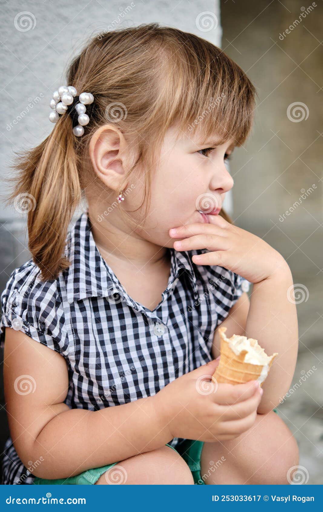 Little Baby Girl Eating Ice Cream Licking Her Fingers Stock Image