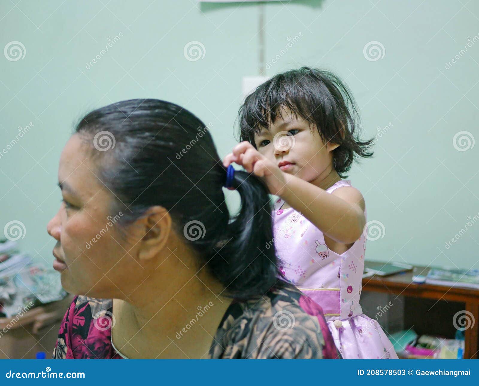 Little Baby Girl, 2 Years Old, Enjoys Playing / Pretending To Do Her  Auntie`s Hairs at Home Stock Image - Image of untie, little: 208578503