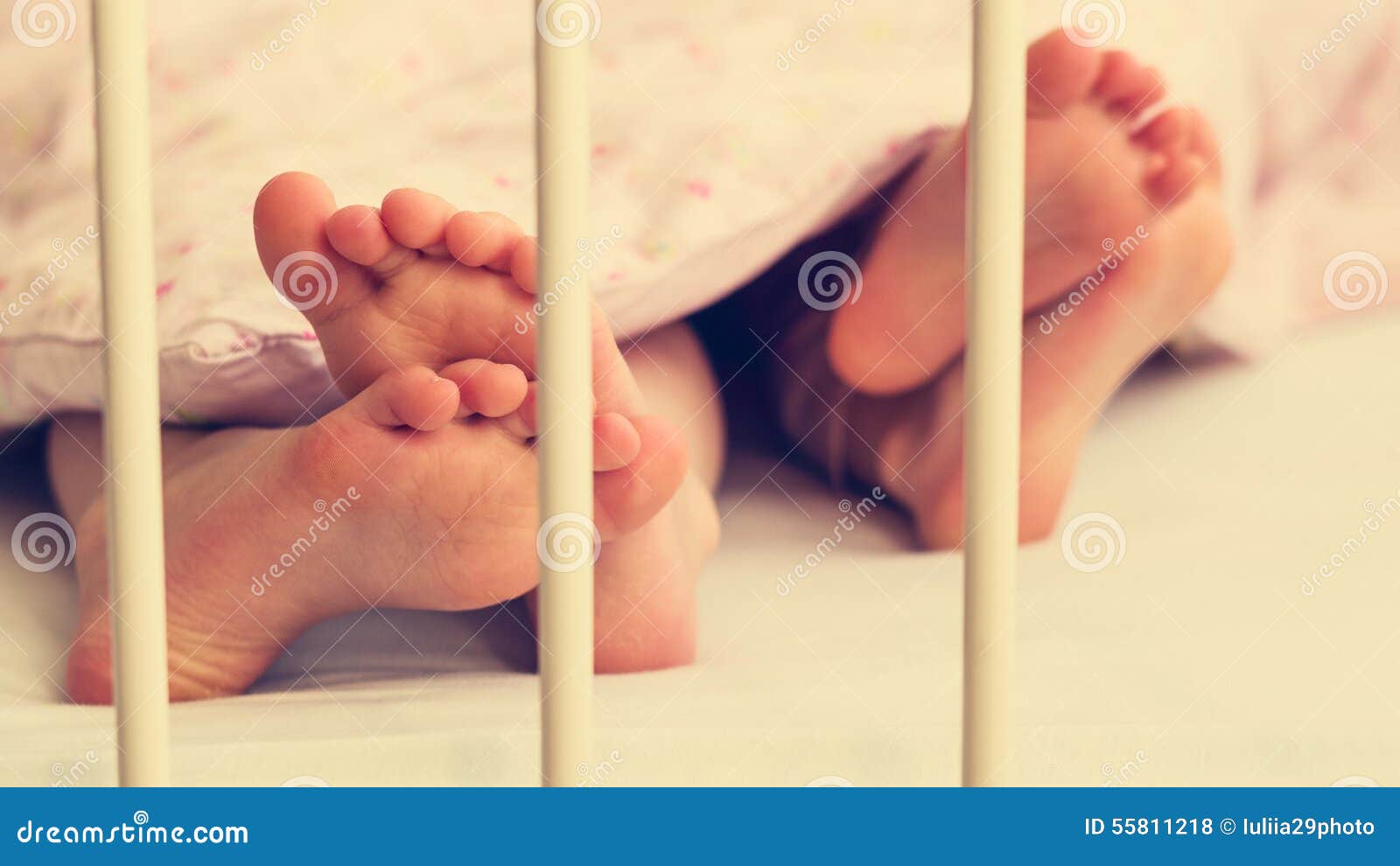Little Baby Legs Under the Blanket. Stock Photo Image of beautiful