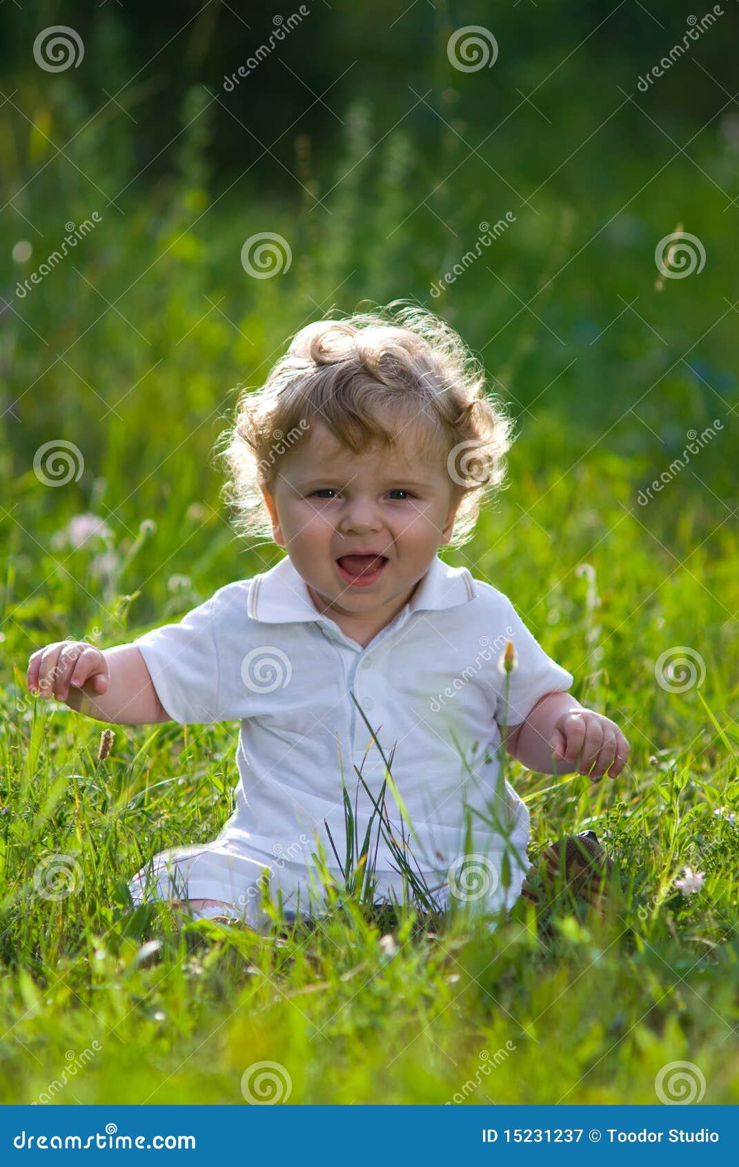 little baby in the midle of green nature