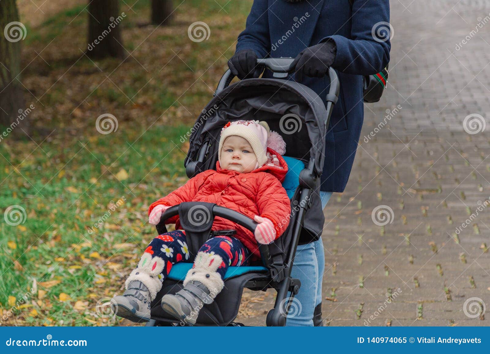 The Little Baby is Sitting in the Pram. Stock Image Image of outdoor