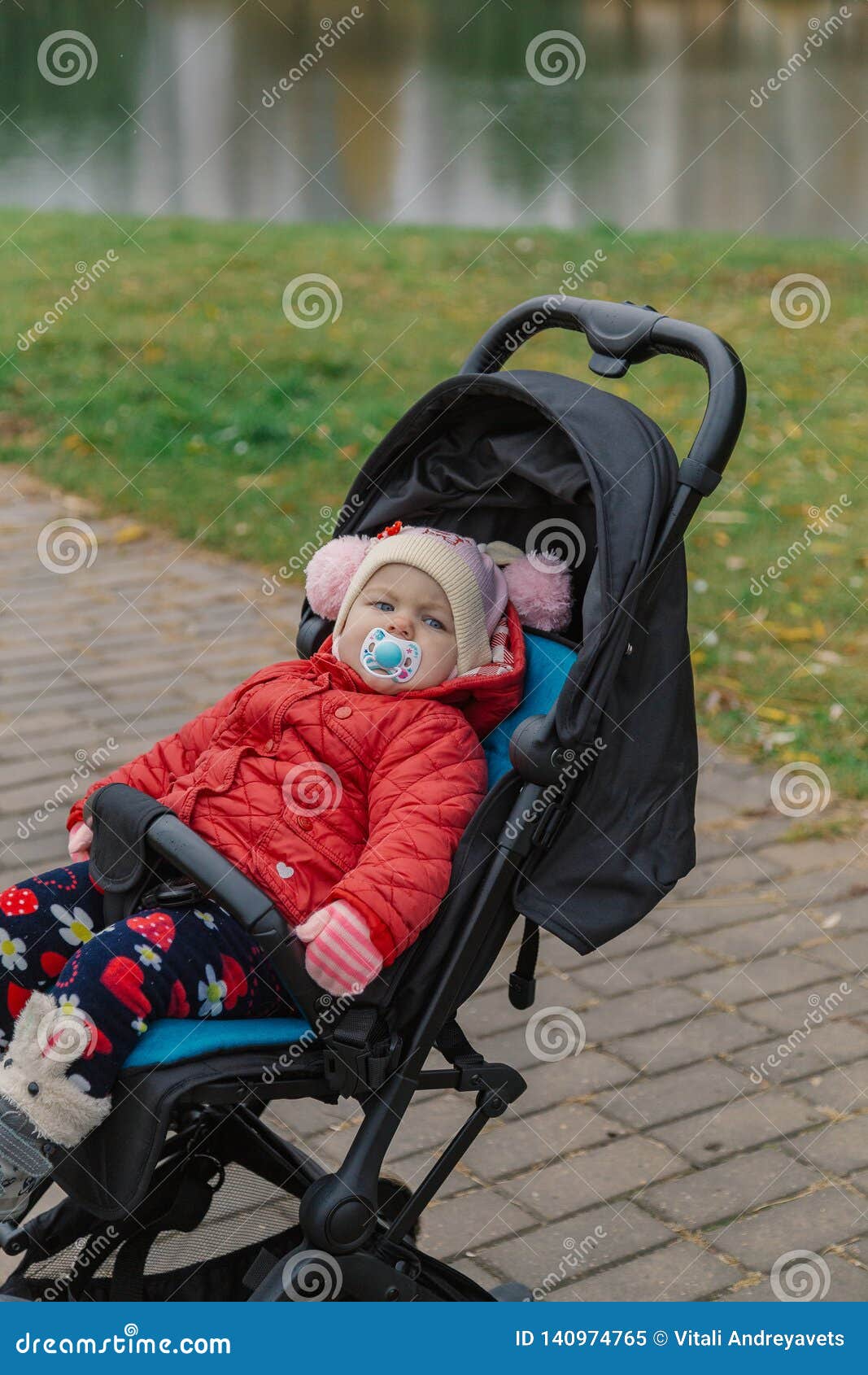 The Little Baby is Sitting in the Pram. Stock Image Image of baby