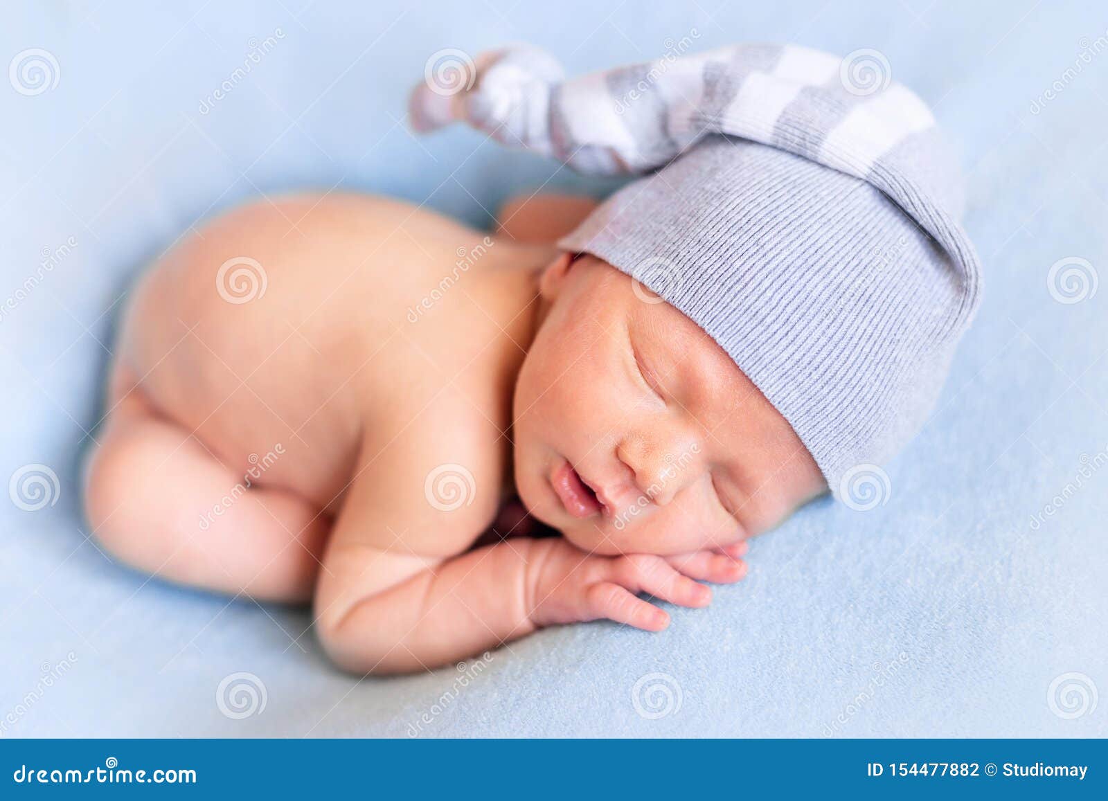 Little Baby is Sleeping in the Night Cap on a Blue Blanket Stock Photo Image of baby