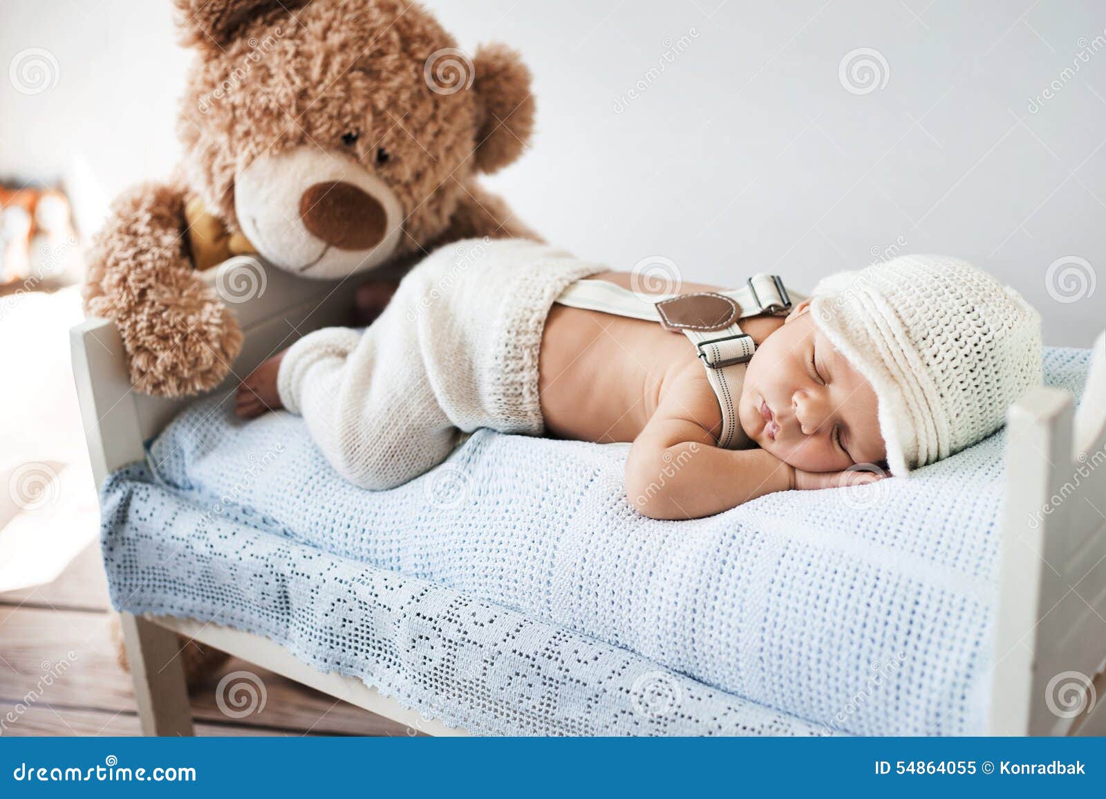 baby sleeping with teddy