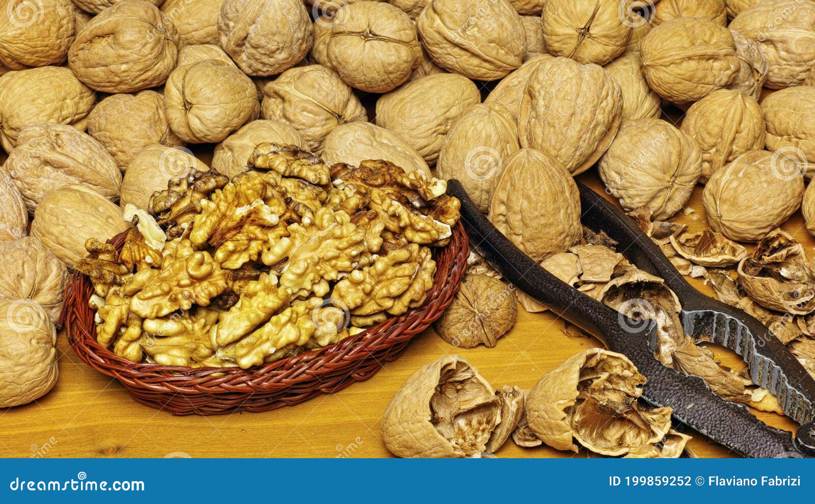 Little Basket Full of Kernels and Many Nuts Around Stock Photo Image