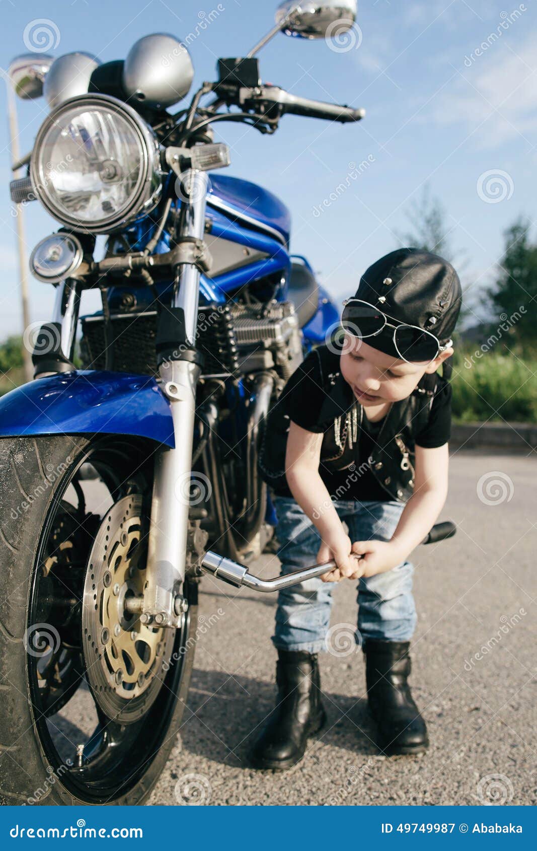 Little Biker Repairs Motorcycle on Road Stock Image Image of leather