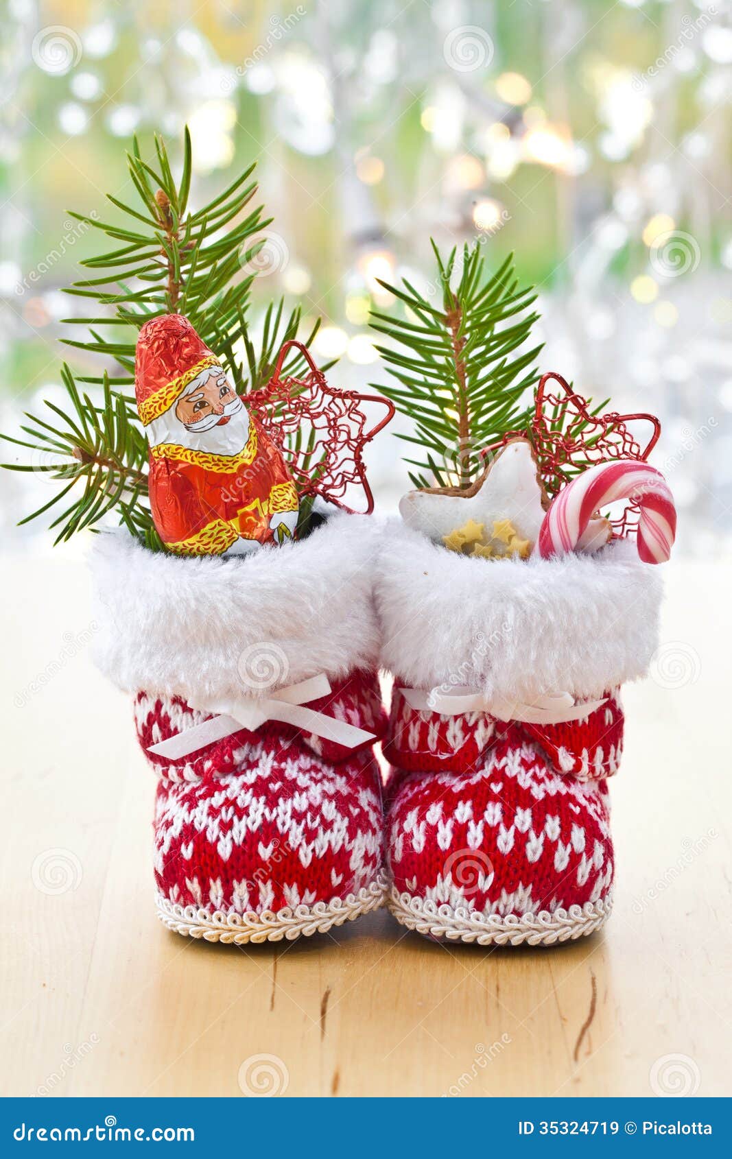 Old Hiking Boots Filled With Sweets Gifts And Christmas Decoration