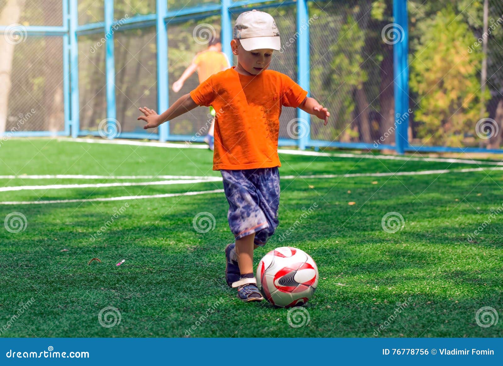 Little boy with the ball. stock photo. Image of light 76778756
