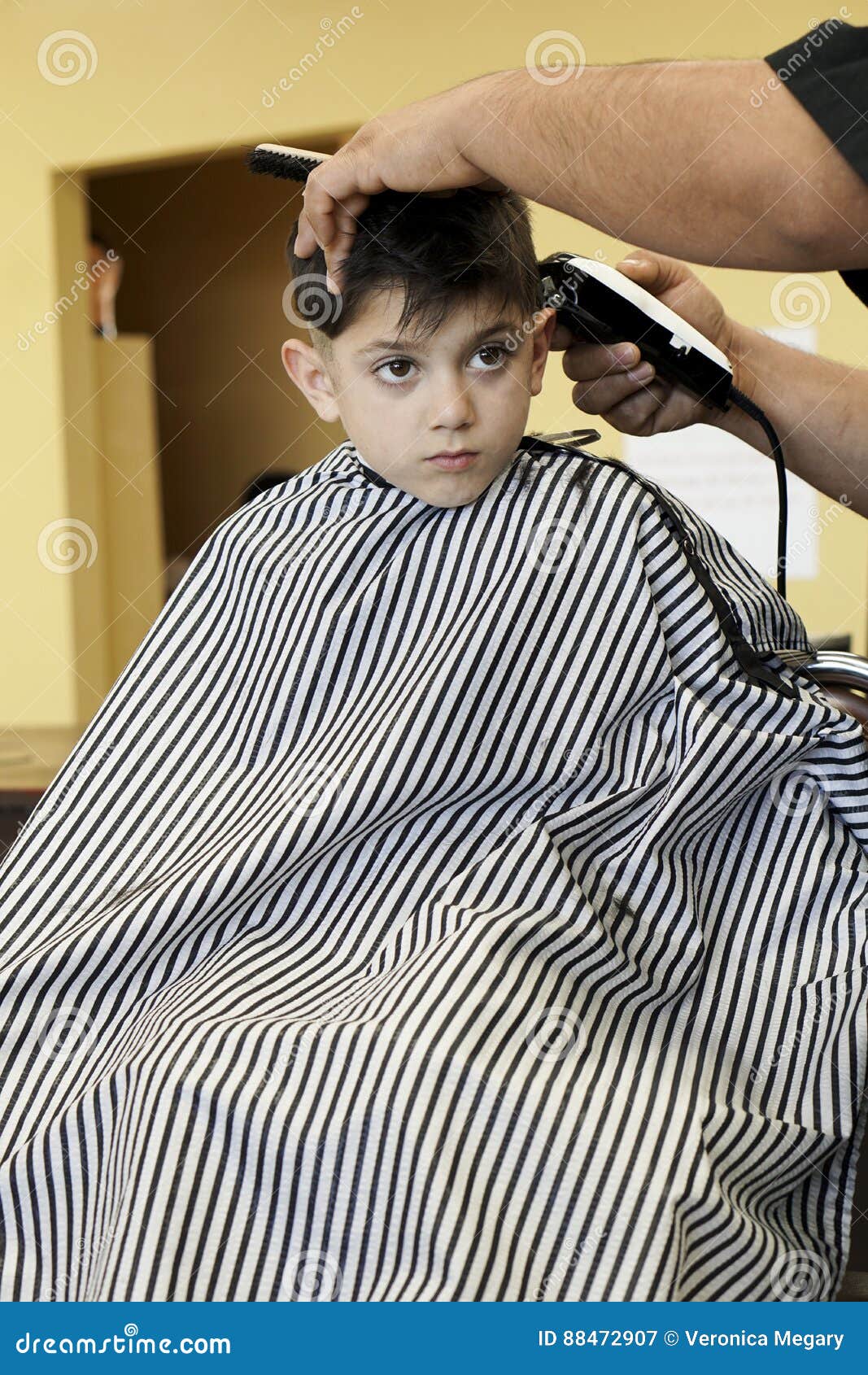 Little Boy Getting A Haircut At The Barber Shop Cartoon 