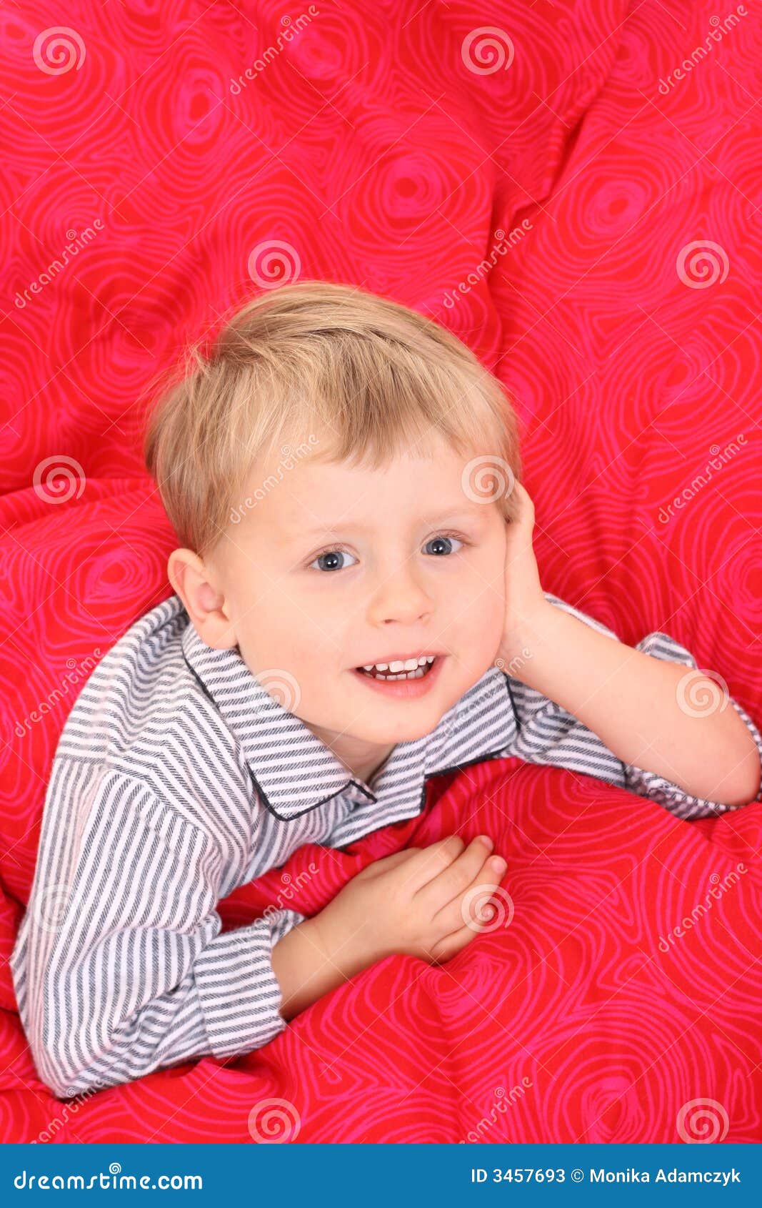 Little boy in bed stock image. Image of smiling, pillow 3457693