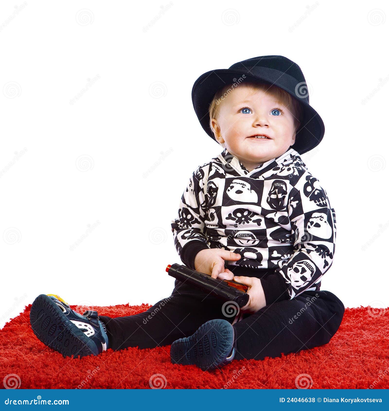 A Little Boy in a Black Hat Sits Stock Photo Image of little, baby