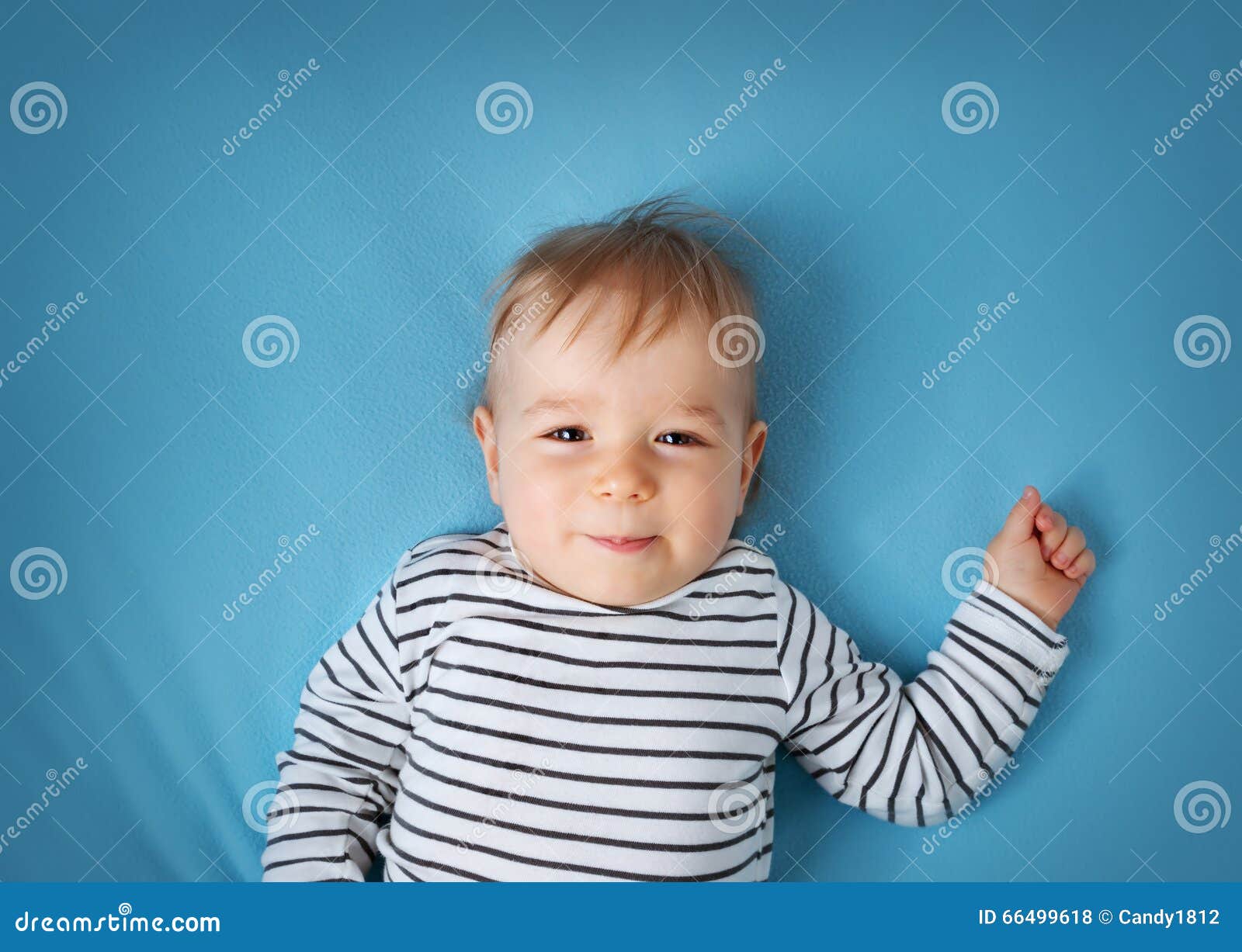 Little Boy on Blue Blanket Background Stock Photo Image of eyes, hand