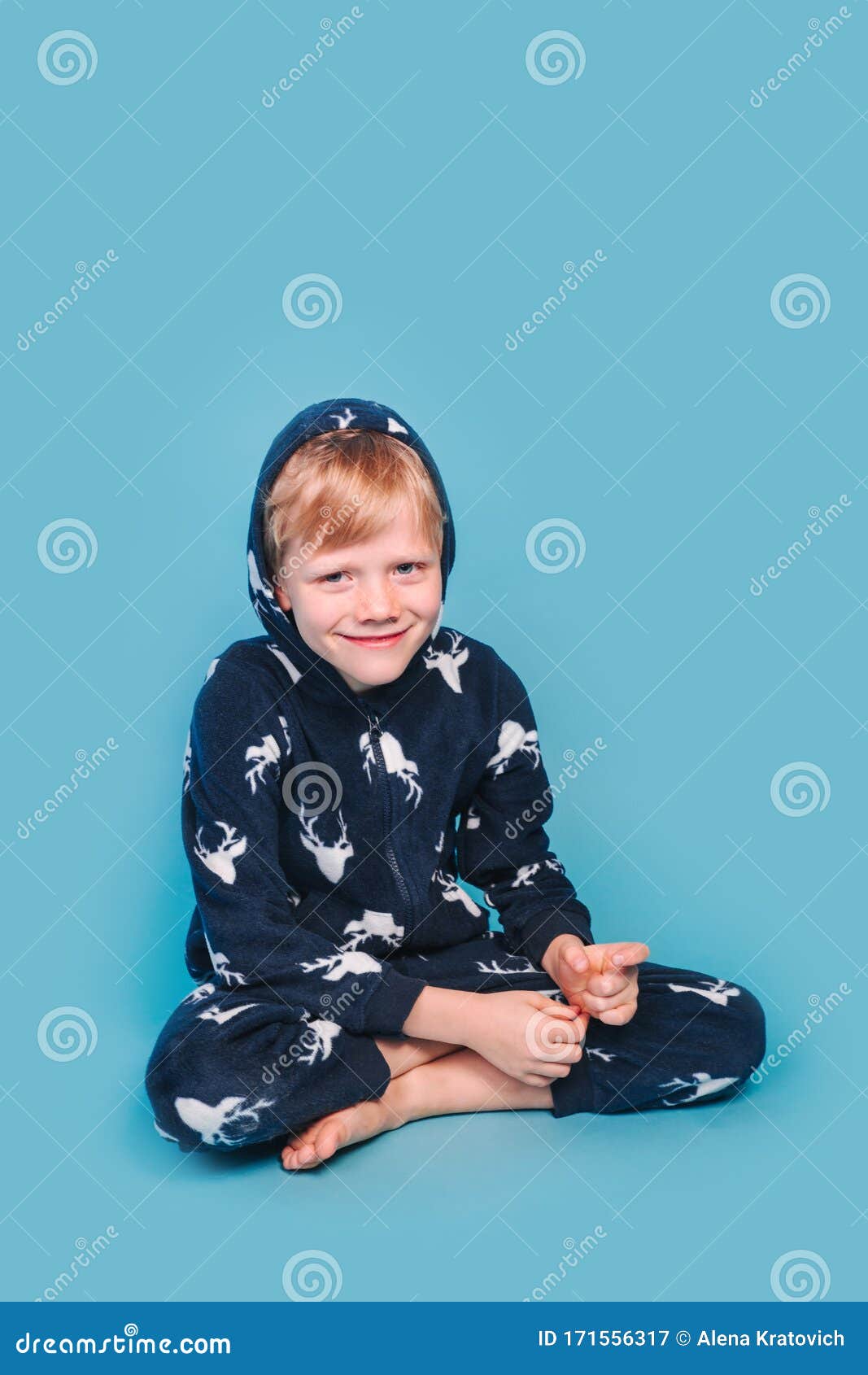 Little Boy in Blue Pyjamas Sitting on Yellow Background Stock Image ...