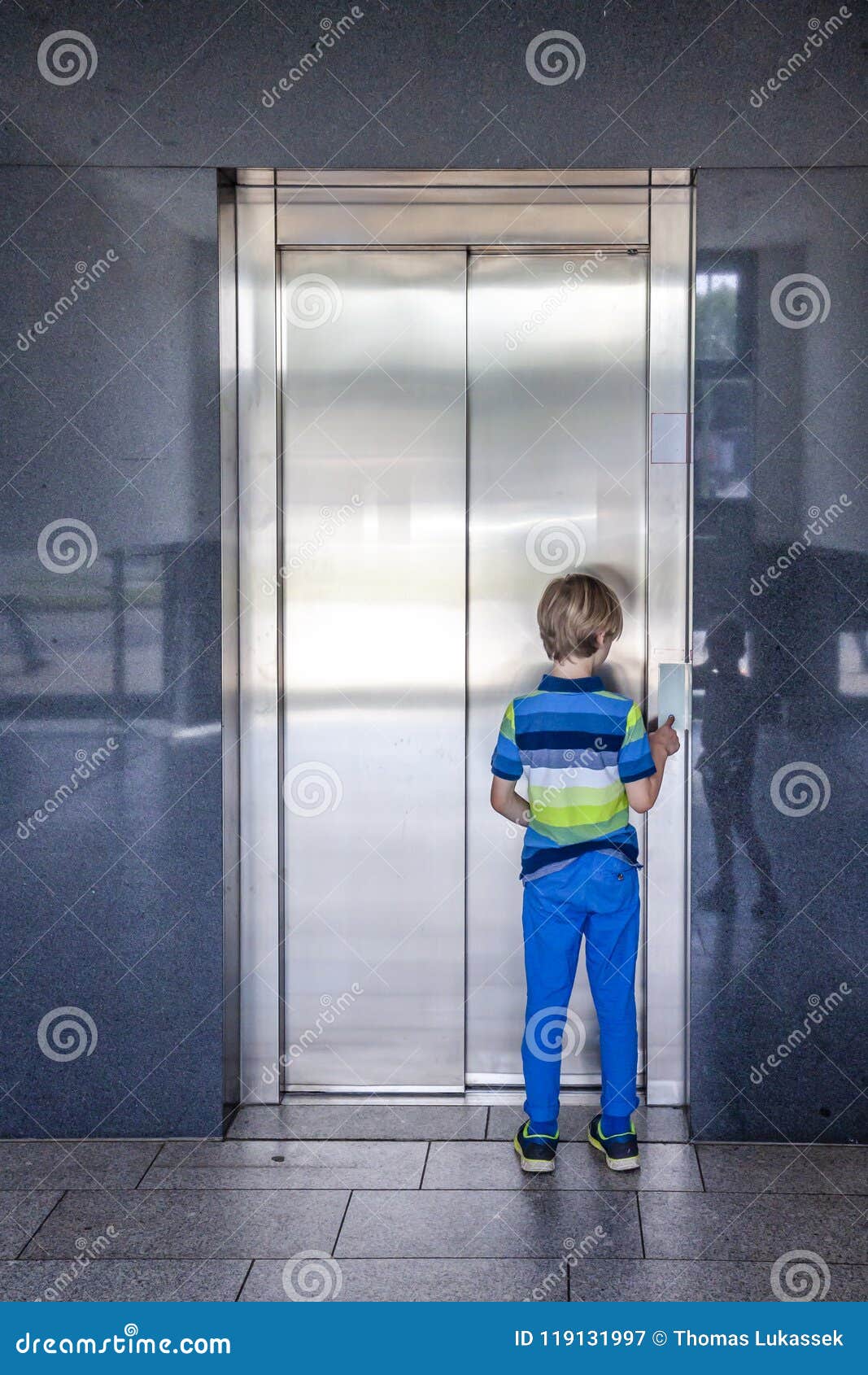 Little Boy is Calling the Elevator Stock Image Image of child