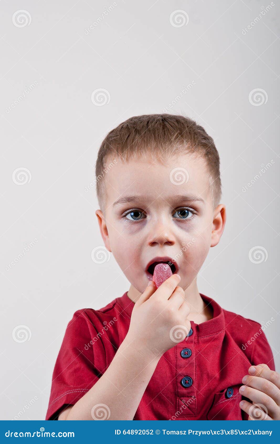Little boy with candy stock photo. Image of studio, candy 64892052