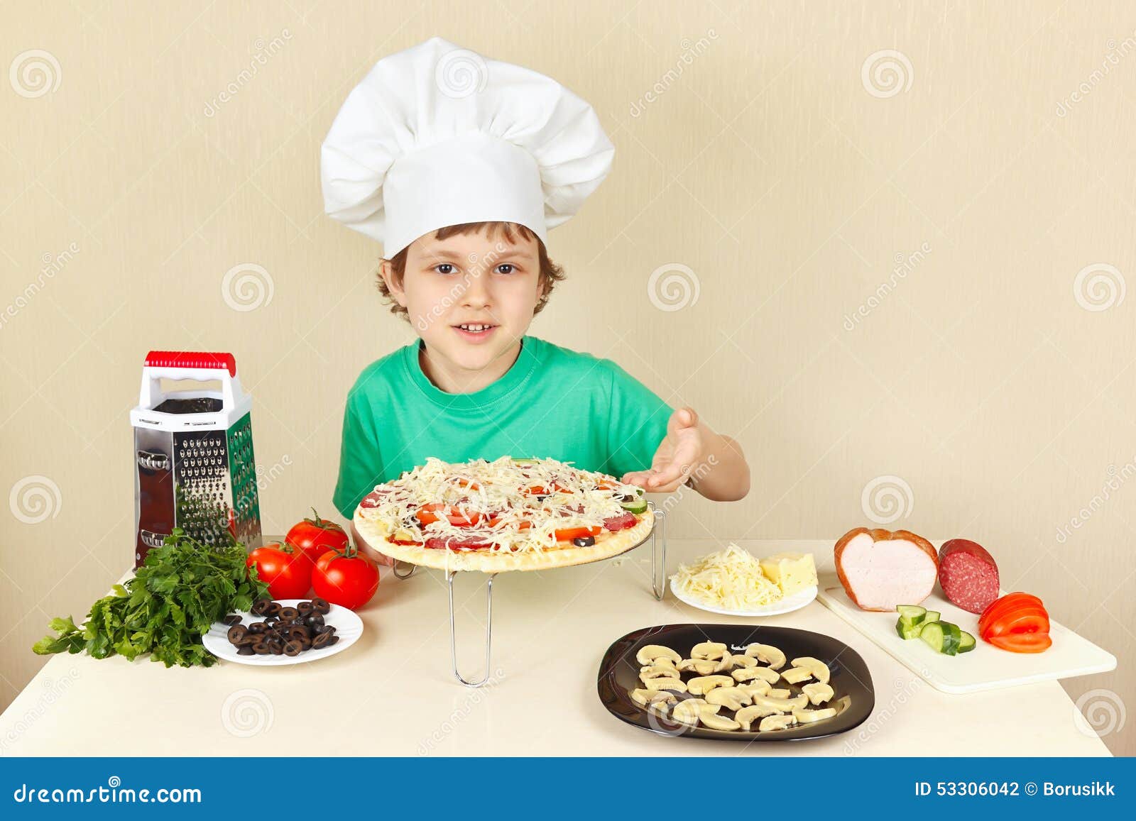 Little Boy in Chefs Hat Shows How To Cook Pizza Stock Photo Image of
