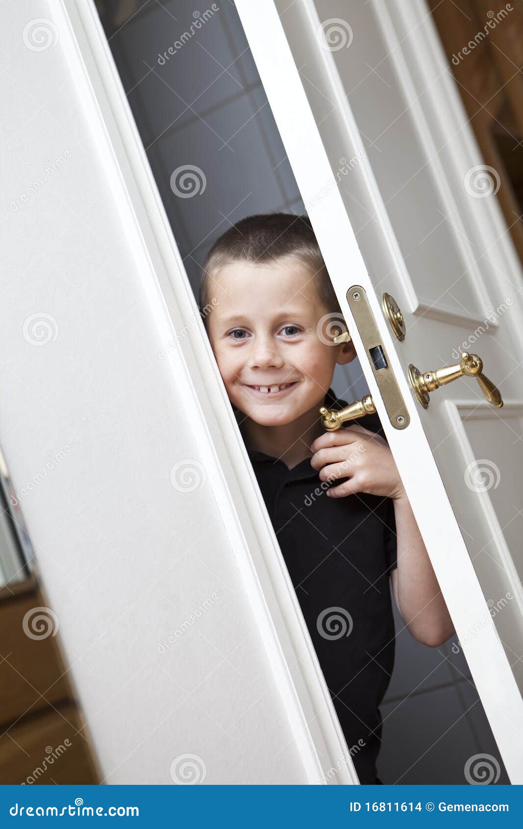 Little Boy by the door stock photo. Image of hide, blond 16811614