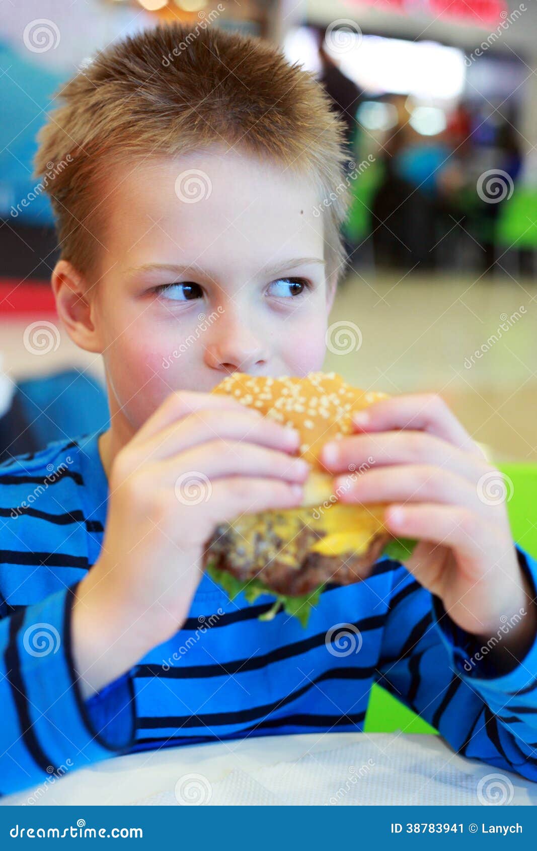 Little boy eating burger stock image. Image of food, enjoying 38783941
