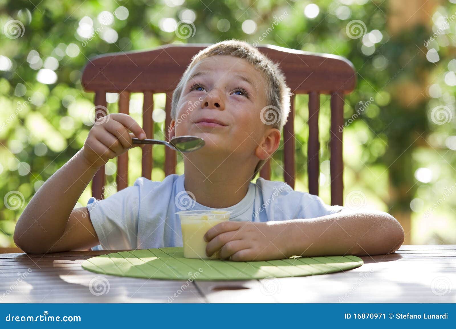 Little boy eating pudding stock image. Image of cheerful 16870971