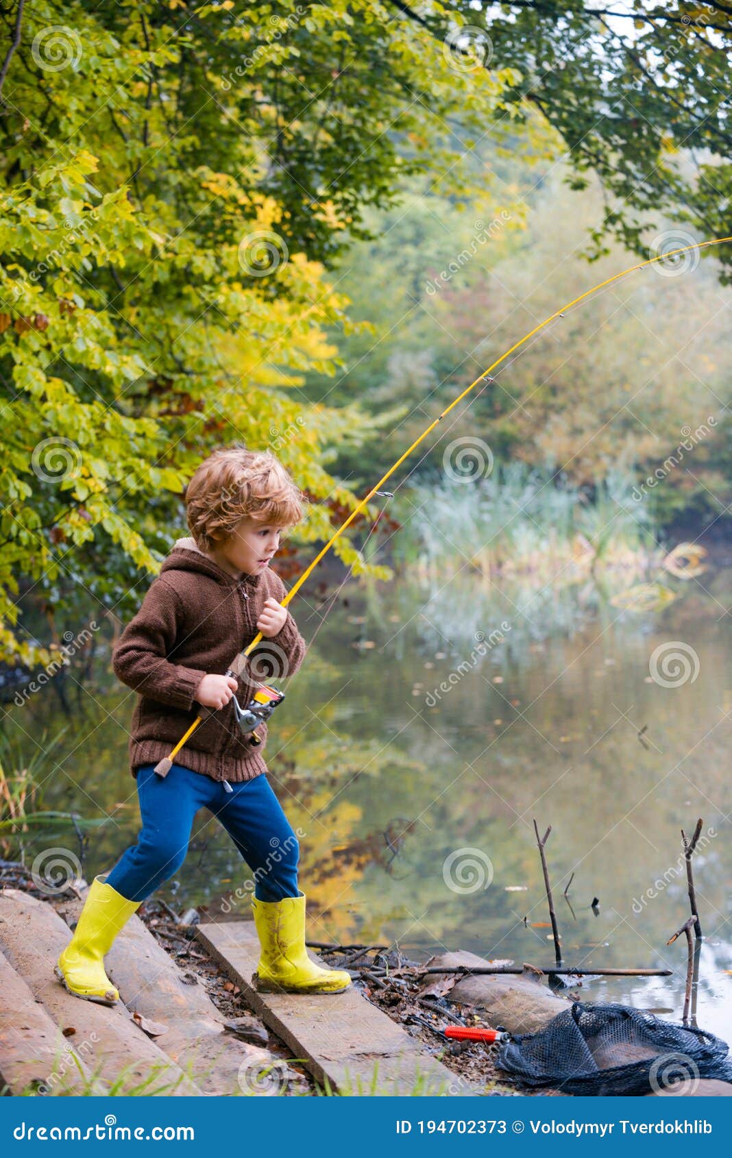 Little Boy Fishing. Kid Pulling Rod while Fishing on Weekend. Stock