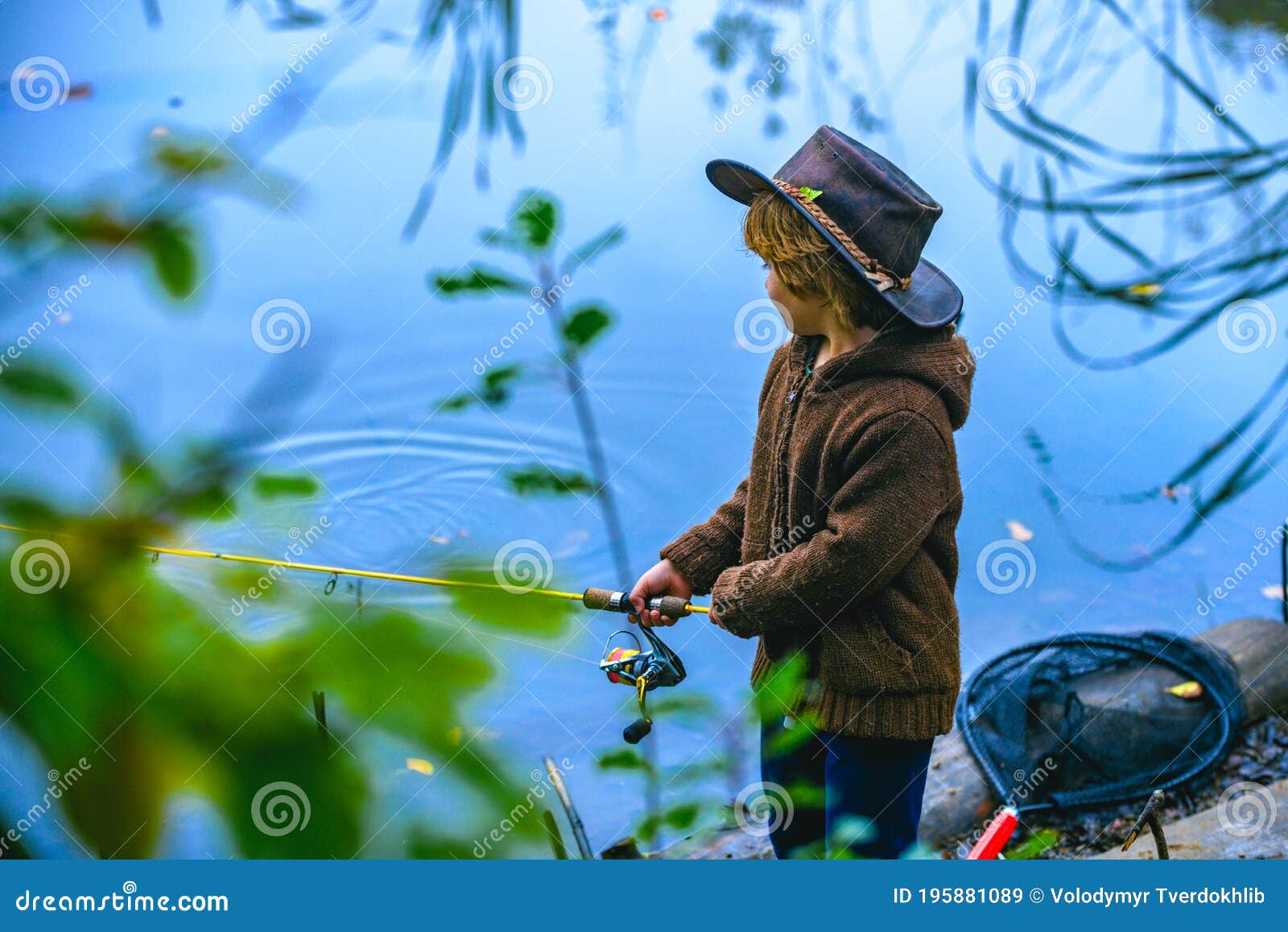 Little Boy Fishing in Overalls from a Dock on Lake or Pond. Child with a  Fishing Rod Standing by the Water Stock Image - Image of weekend, fishrod:  195881089
