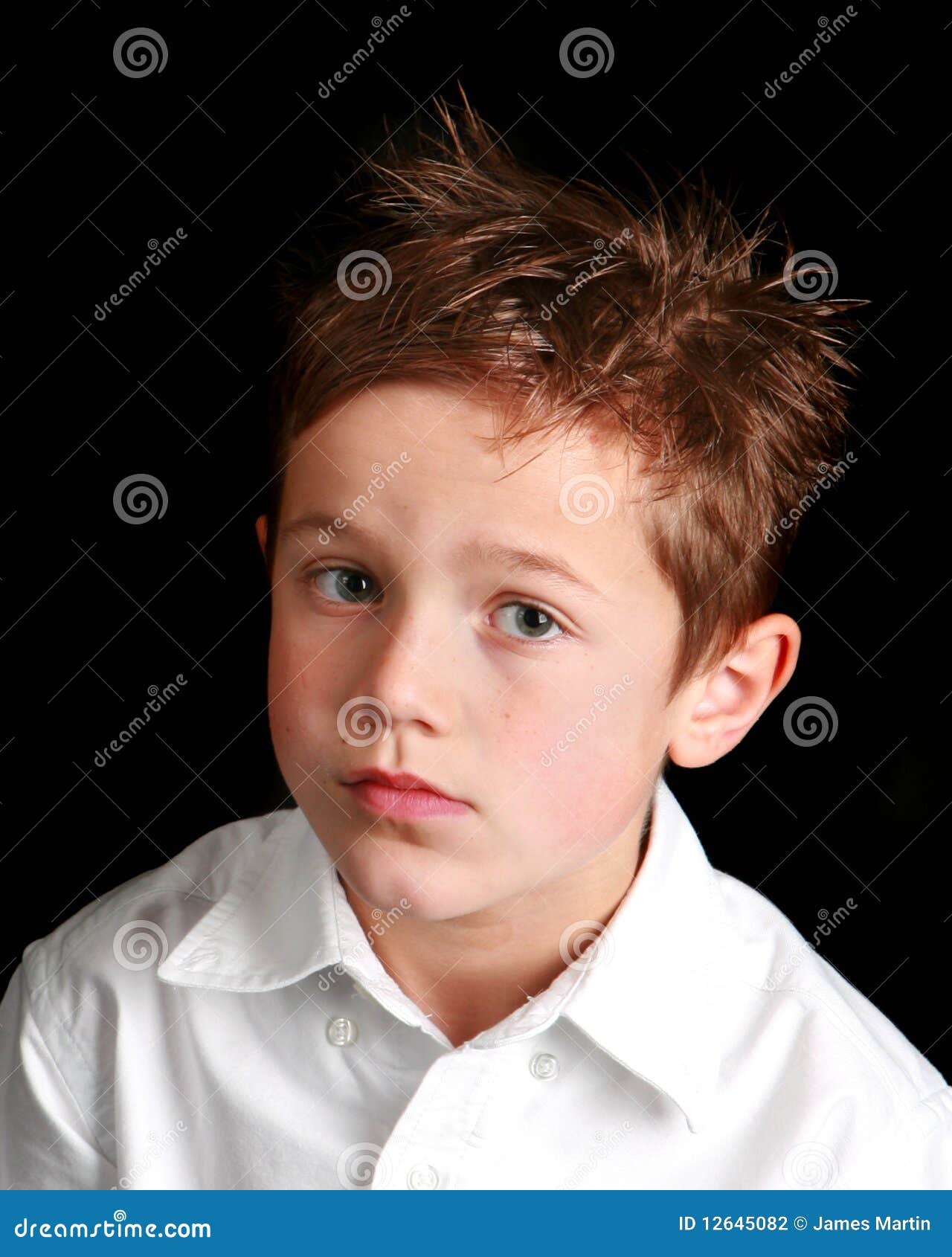little boy with a forlorn expression