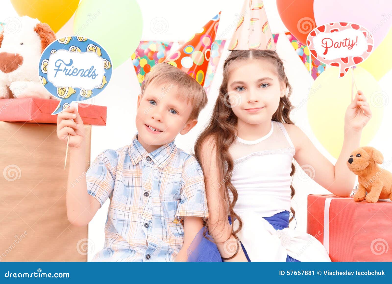 Little Boy  And Girl  Posing During Birthday  Party Stock 