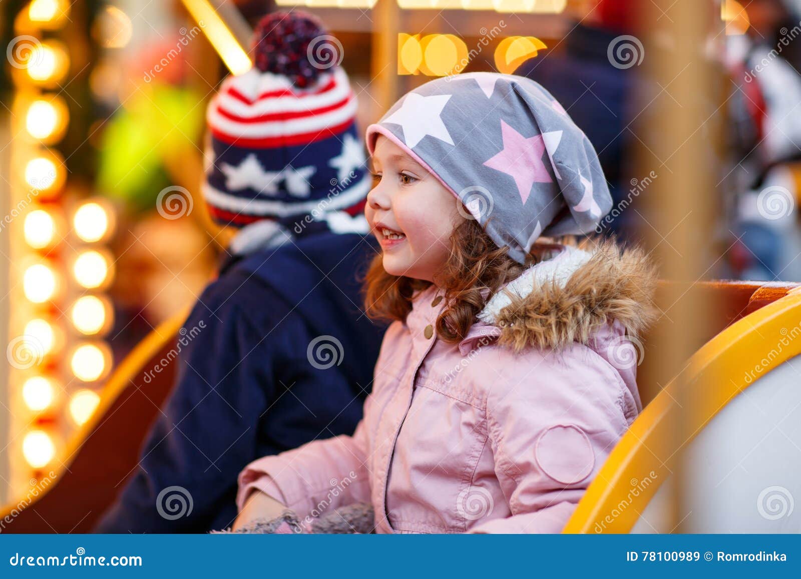 Little Boy and Girl, Siblings on Carousel at Christmas Market Stock ...