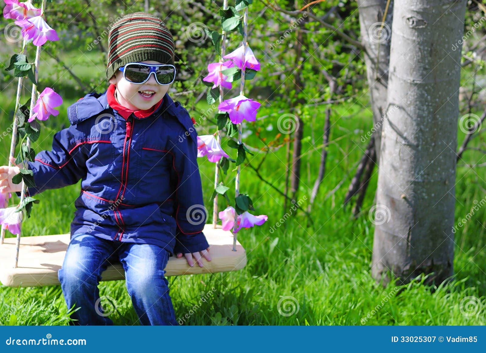 Little Boy with Glasses on a Swing Stock Image Image of child, grass