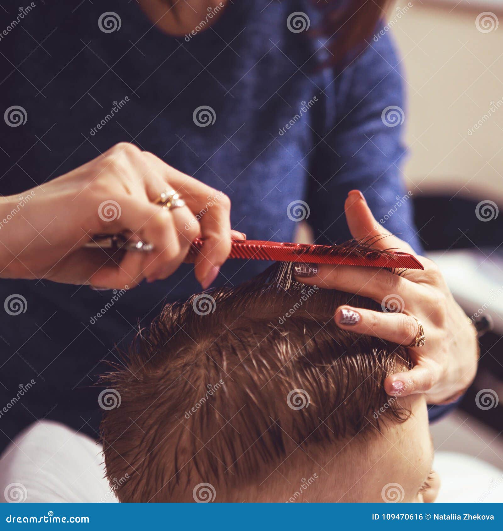 Little Boy At The Hairdresser. Child Is Scared Of Haircuts. Hair Stock