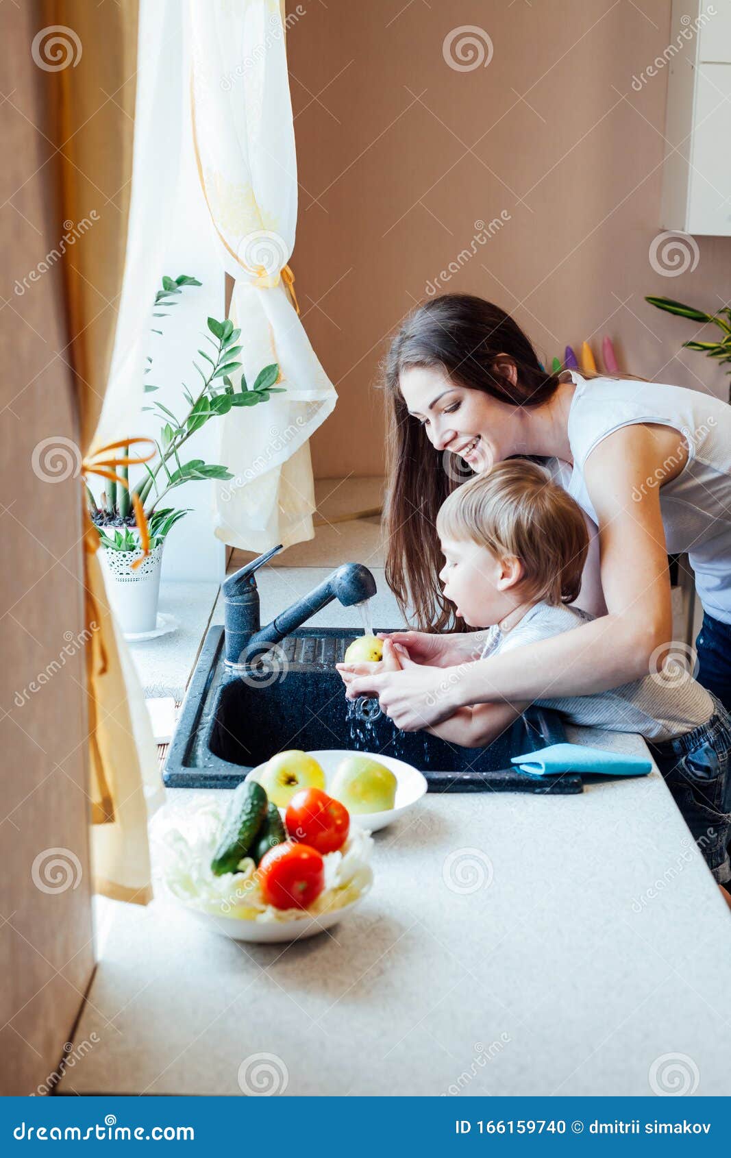 The Little Boy Is Helping Mom I