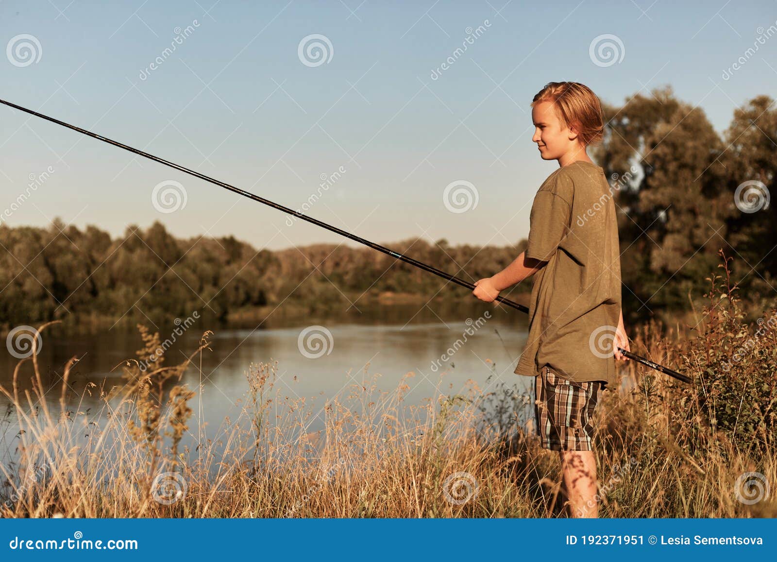 Little Boy Holding Fishing Pole in Hands, Wearing Green T Shirt and Cap,  Blond Male Kid Fishing at Bank of River, Looks Stock Image - Image of  landscape, angling: 192371951