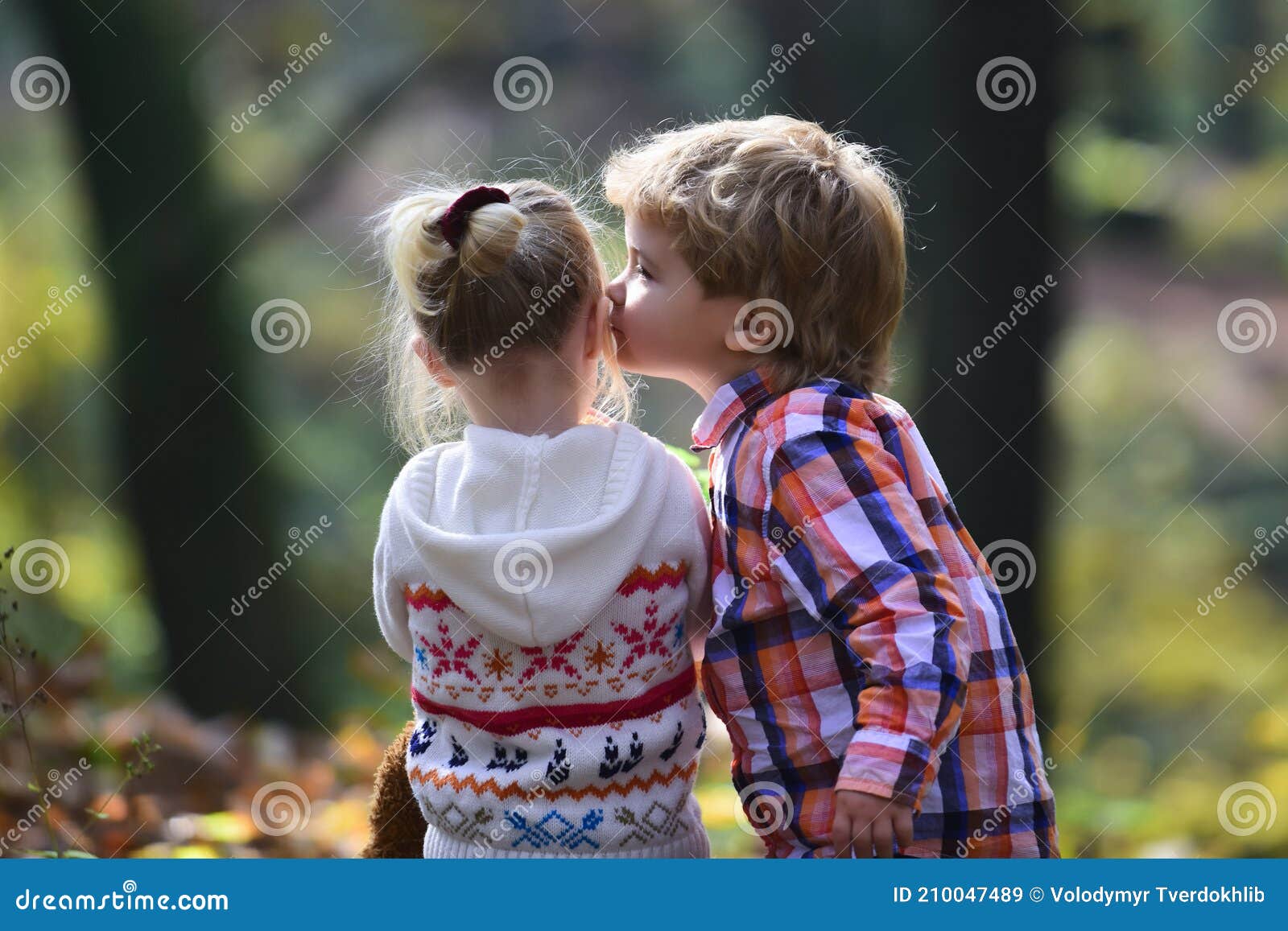 Little Boy Kiss Small Girl Friend in Autumn Forest. Brother Kiss ...