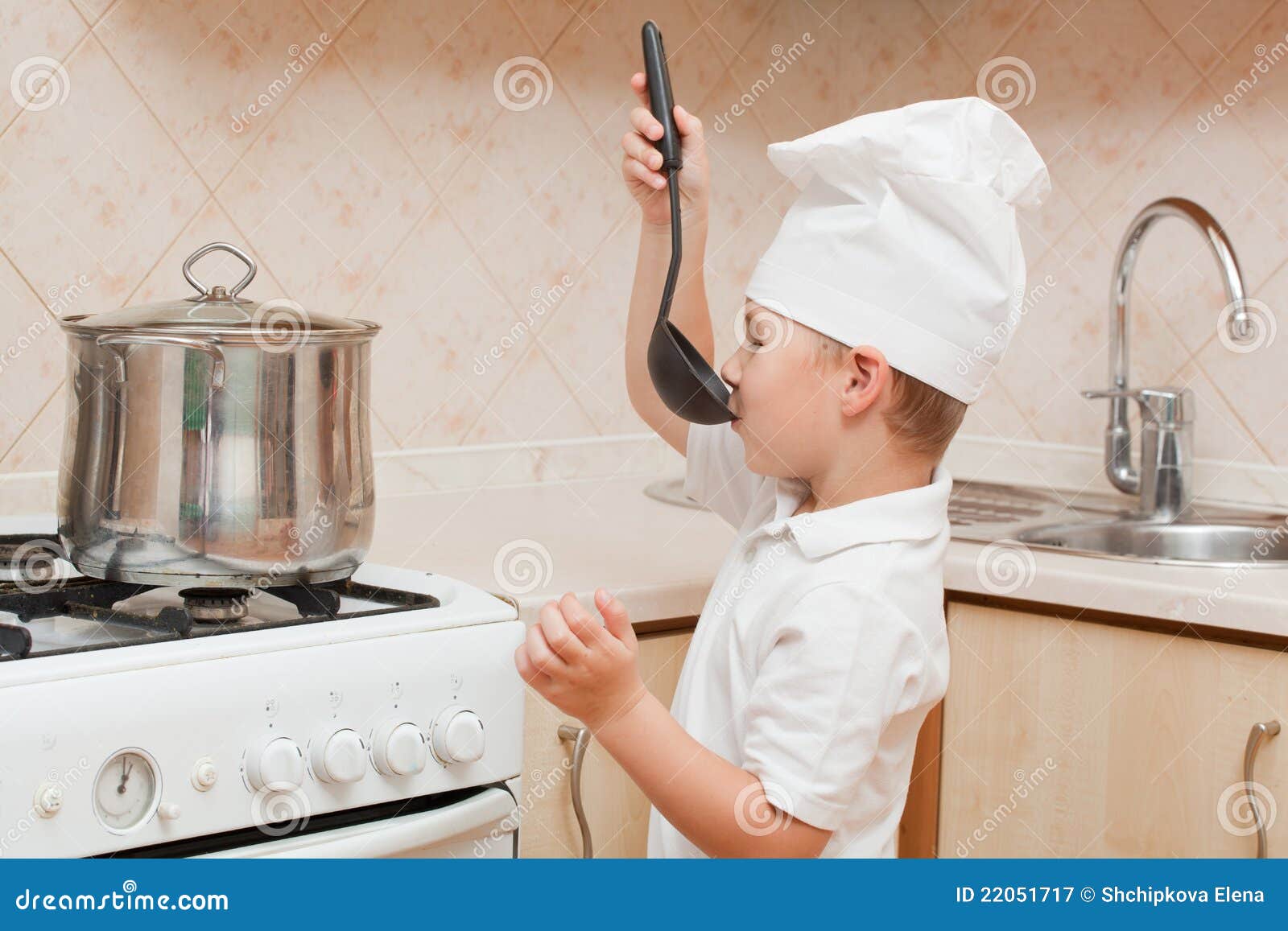 Little boy on kitchen stock image. Image of game, small 22051717
