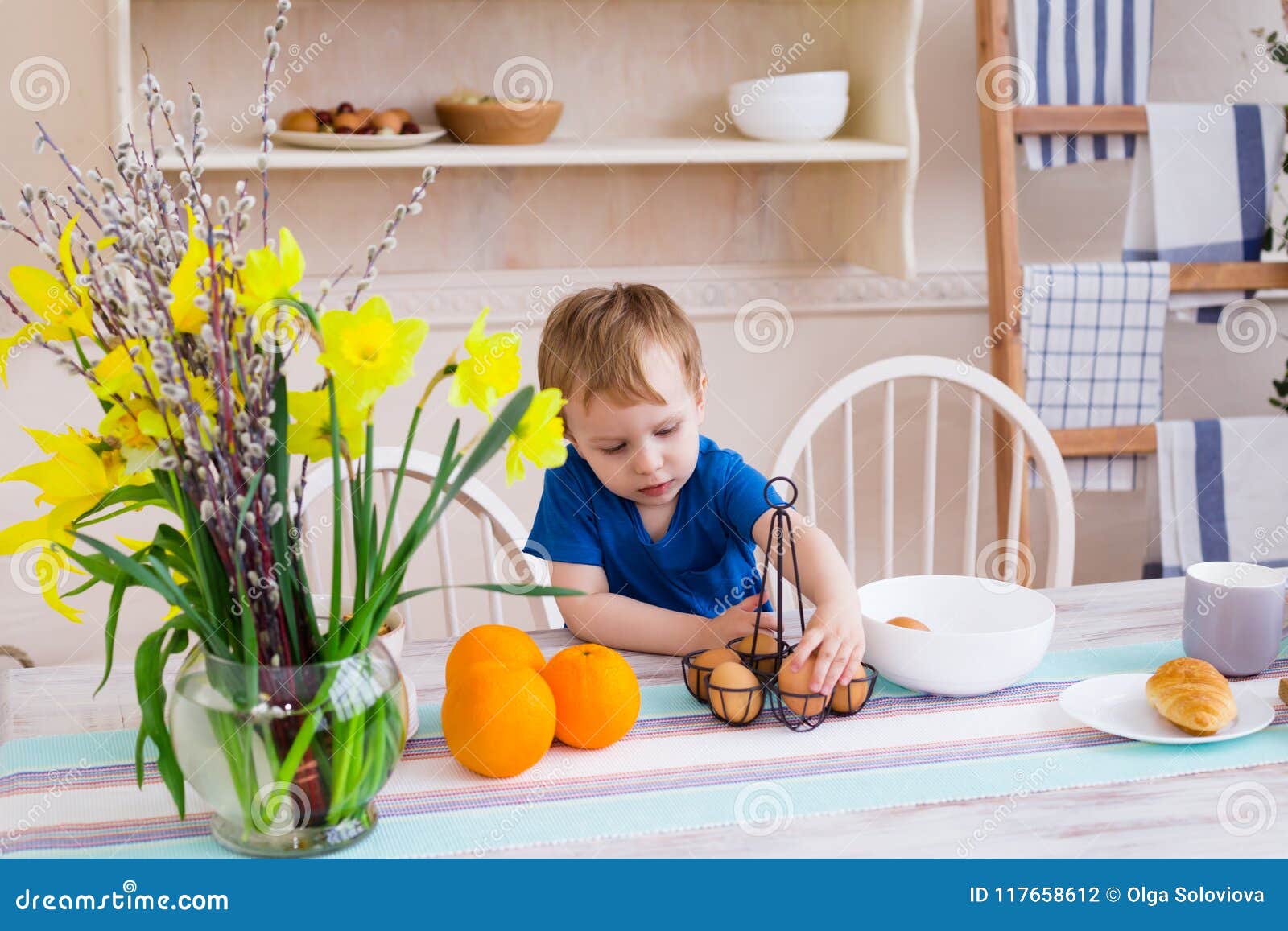 Little Boy in the Kitchen. Kid Playing with Eggs in the Kitchen Stock
