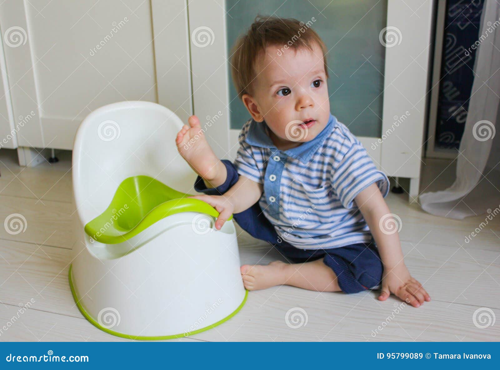 A Little Boy Learns To Go Potty. Accustom the Child To the Potty Stock