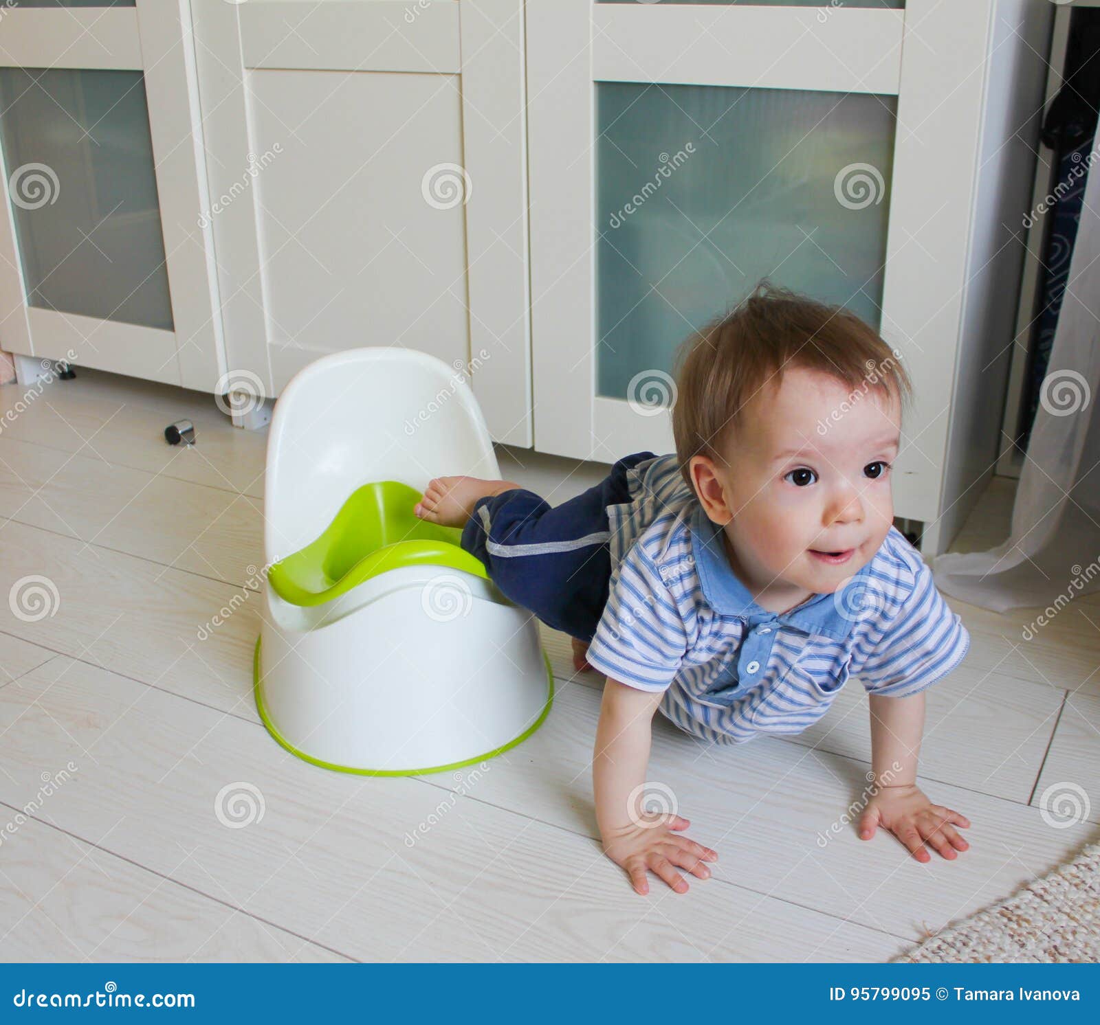 A Little Boy Learns To Go Potty. Accustom the Child To the Potty Stock ...