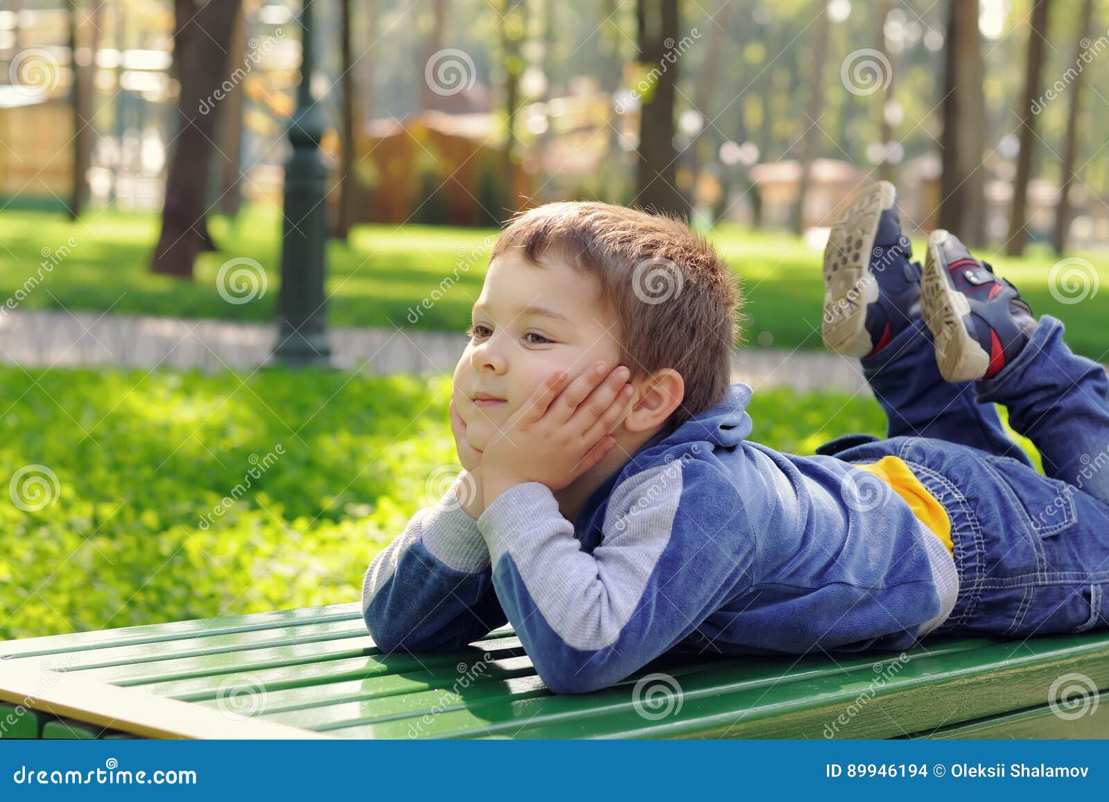 Little Boy Lying on the Bench Stock Photo Image of bench, happy 89946194