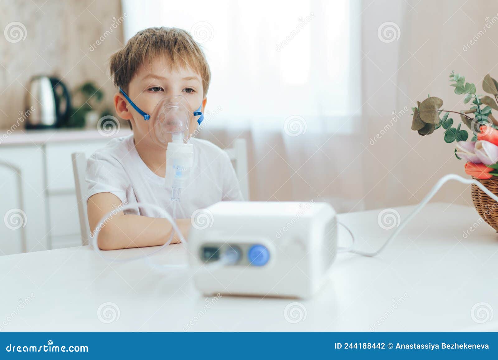 Little Boy with Mask from Nebulizer Sits at Table Stock Photo Image