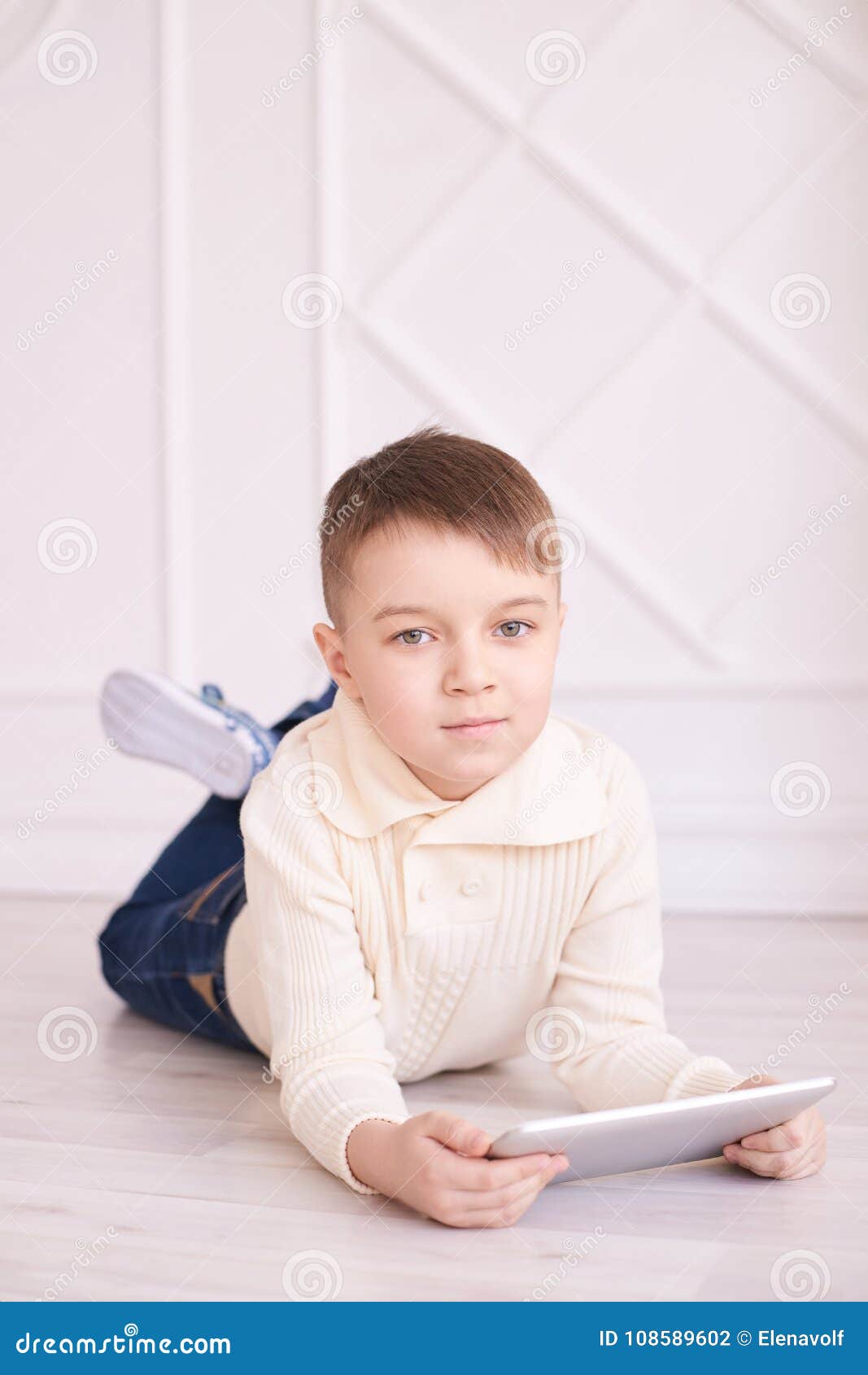 Little Boy. Modern Training. Bright Interior. Vertical Stock Photo