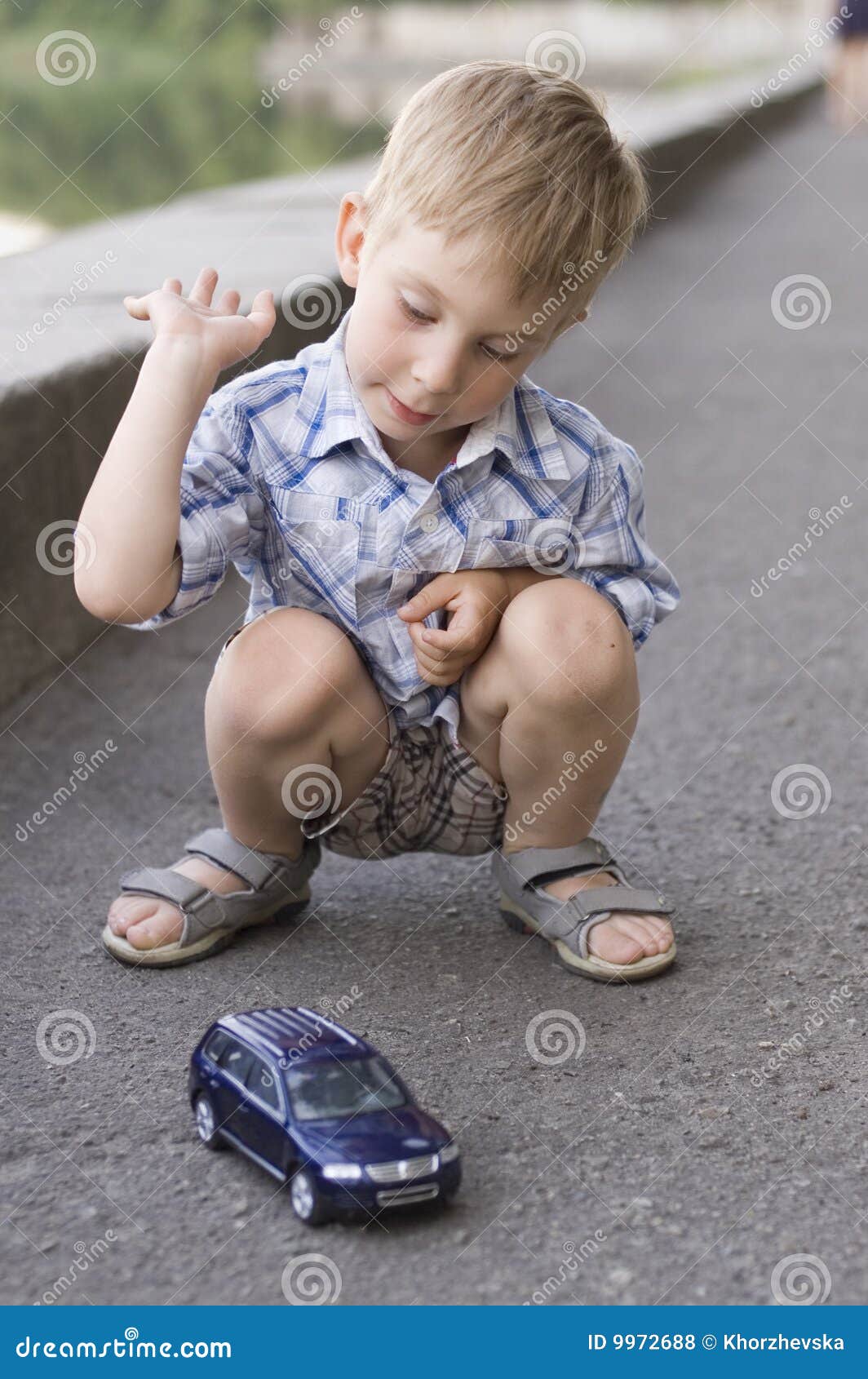 Little boy play with a car stock photo. Image of blue 9972688