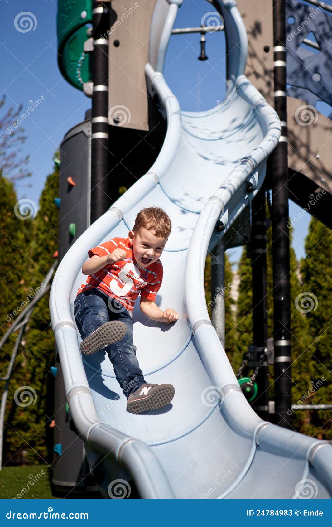 Little Boy On The Playground Slide Stock Photos Image 