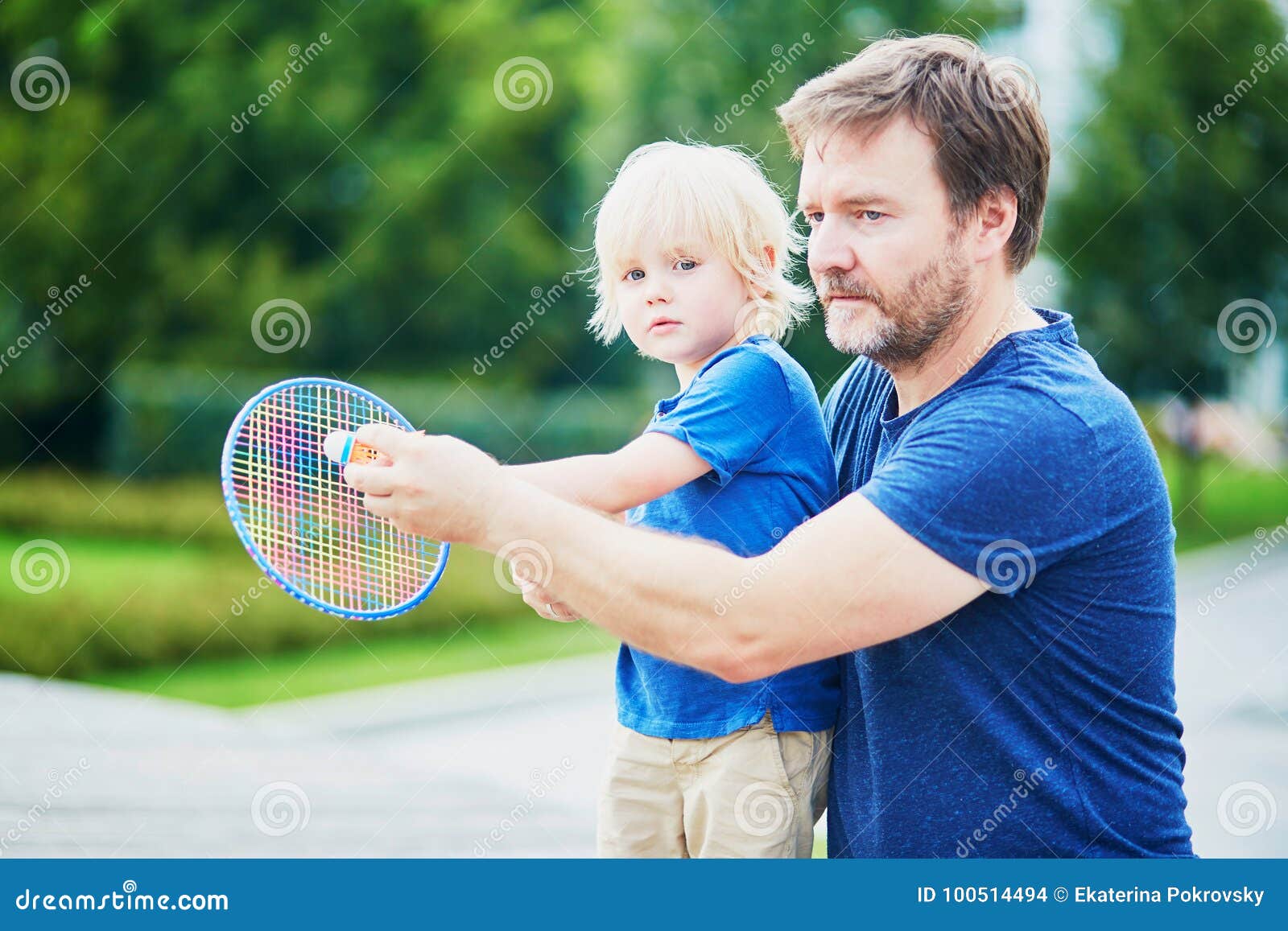 Little Boy Playing Badminton With Dad On The Playground ...