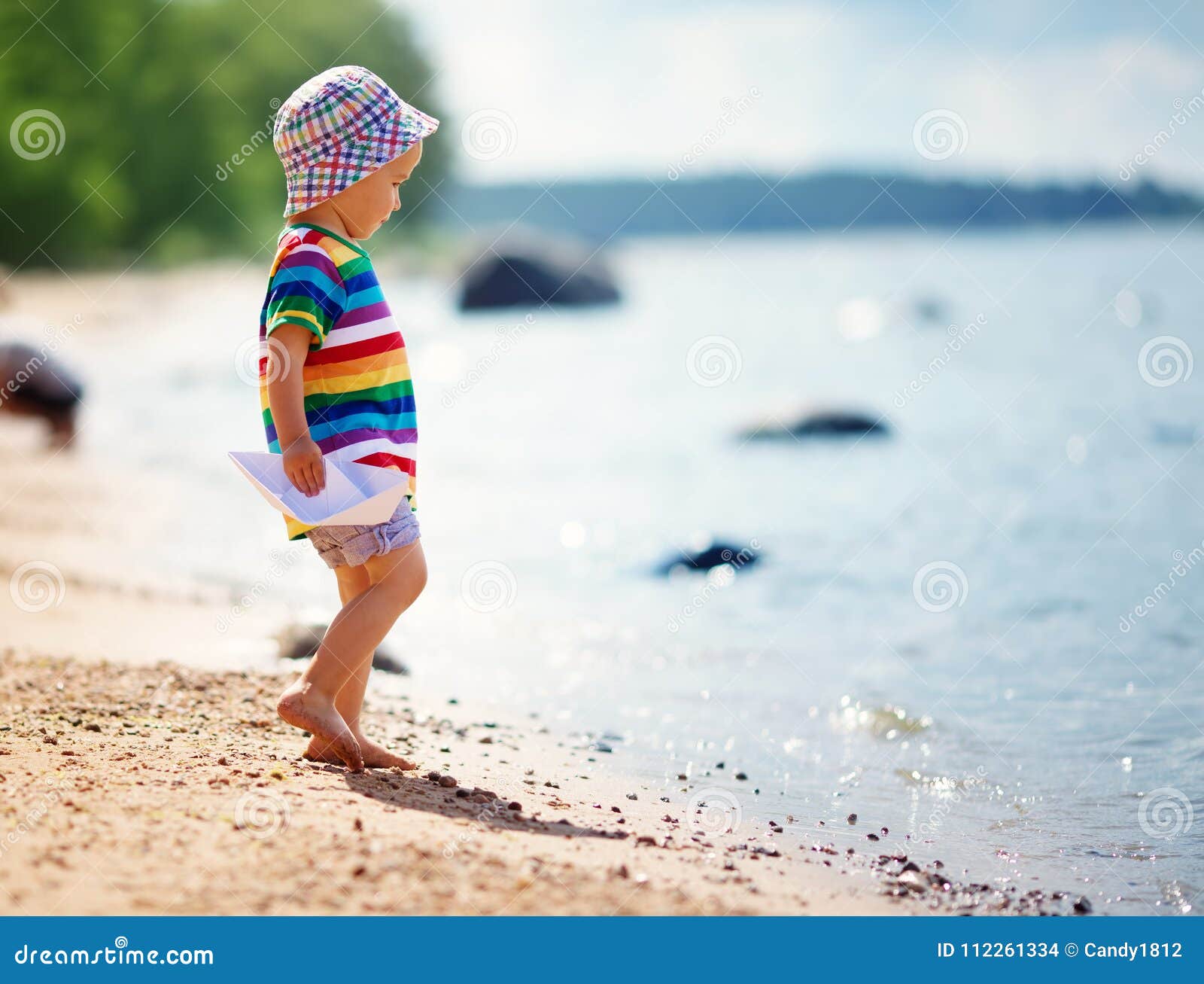 Little Boy Playing at the Beach in Hat Stock Photo - Image of holding ...