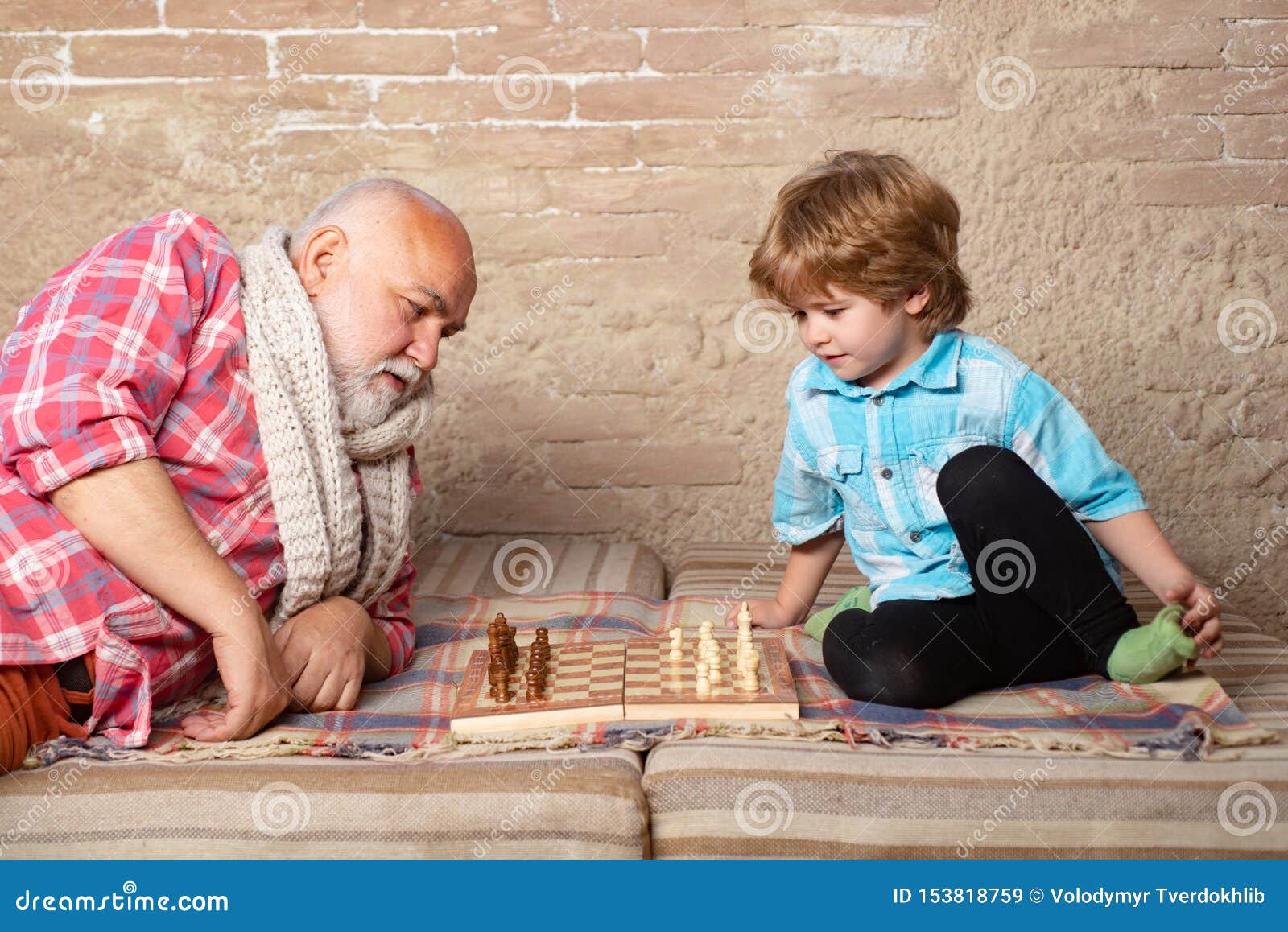 Children's Restraining Hand Thoughtfully Figure Before The Next Chess Move  Stock Photo, Picture and Royalty Free Image. Image 77247675.