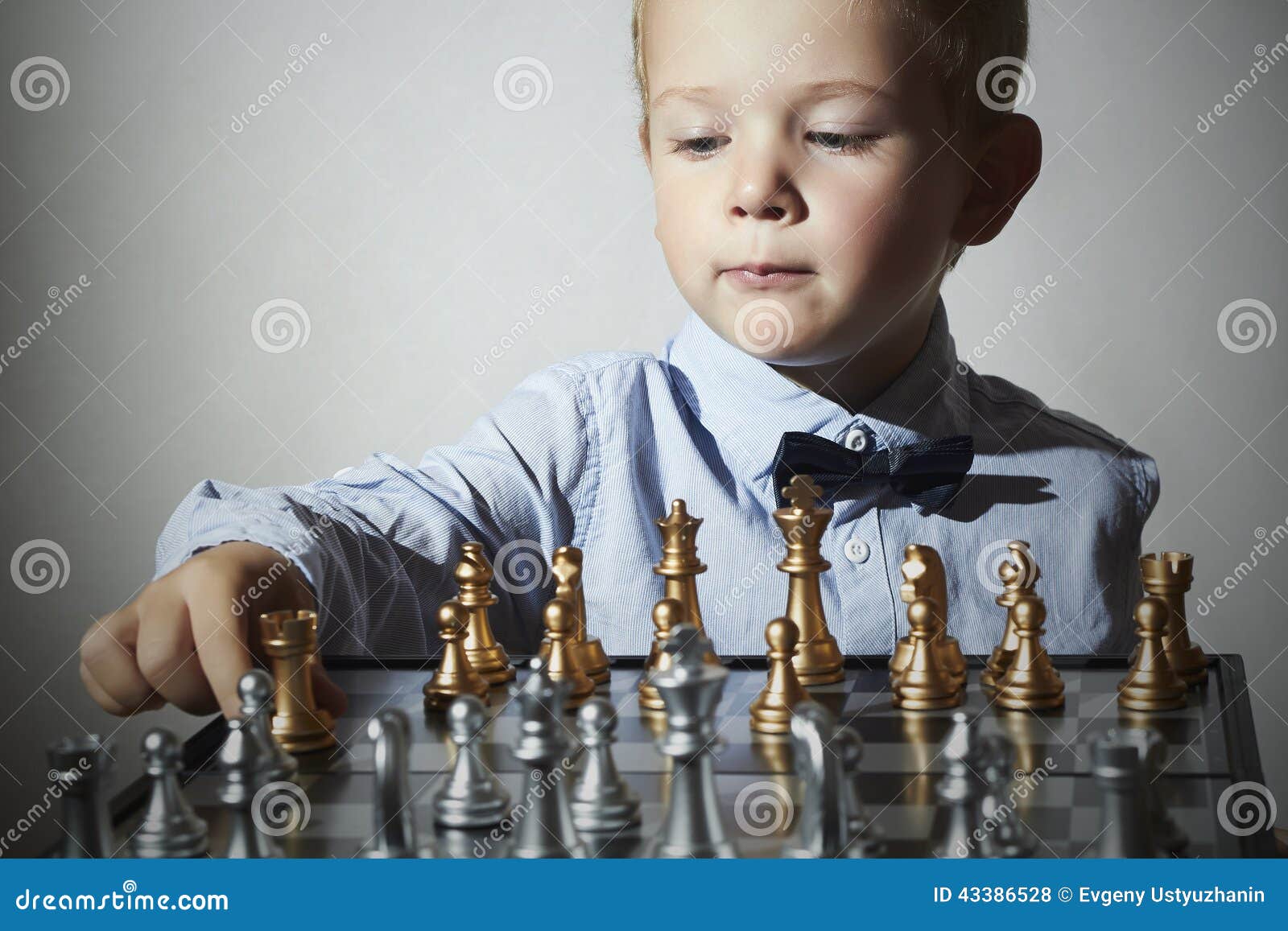 little boy playing chess.smart kid.little genius child. intelligent gam