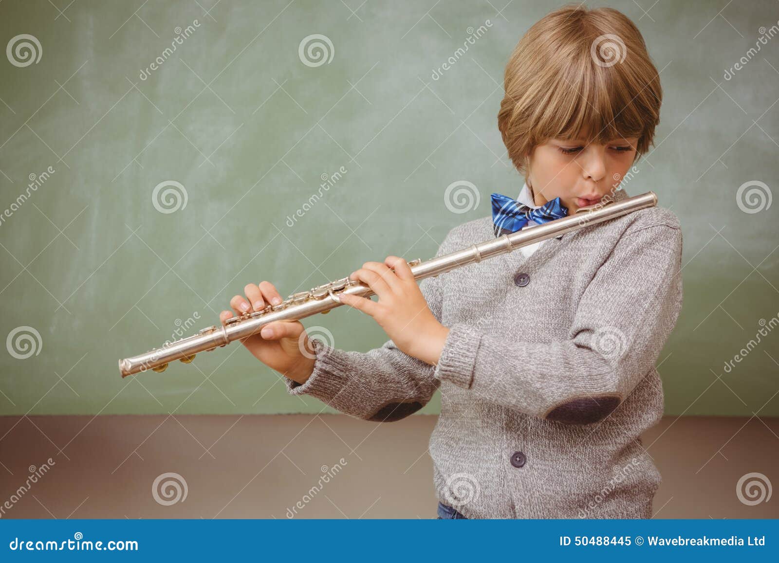 Little Boy Playing Flute in Classroom Stock Image Image of learning
