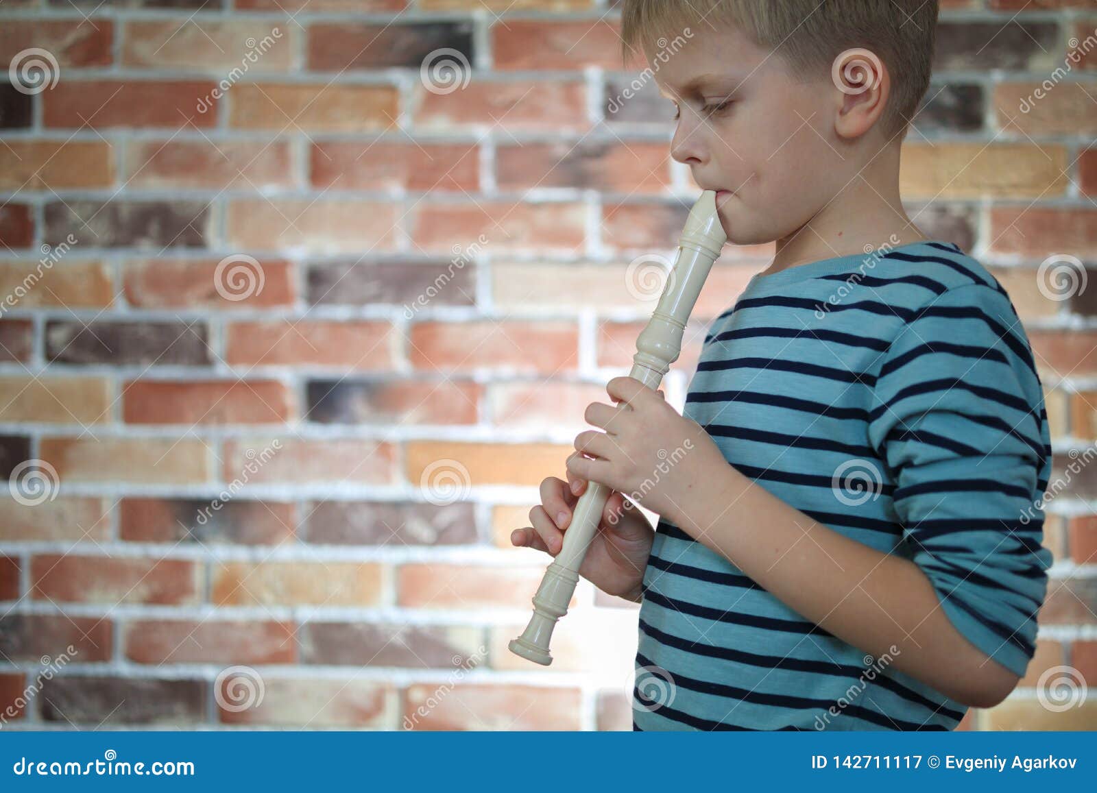 Little Boy Playing the Flute at Home Stock Image Image of instrument