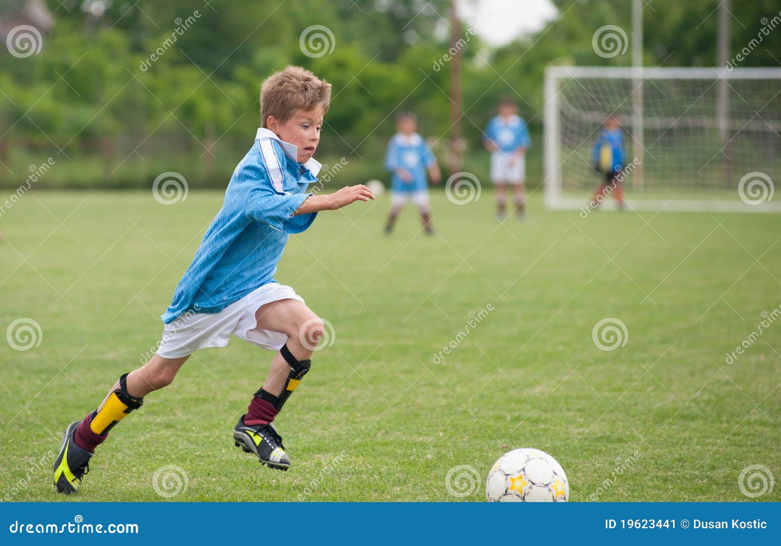 Little Boy Dribbling Basketball Sideview RoyaltyFree Stock Photo