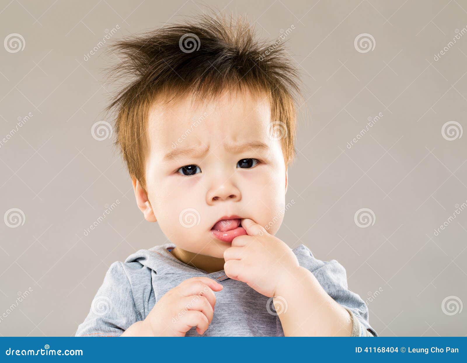 Little Boy Put Finger into Mouth Stock Photo Image of background